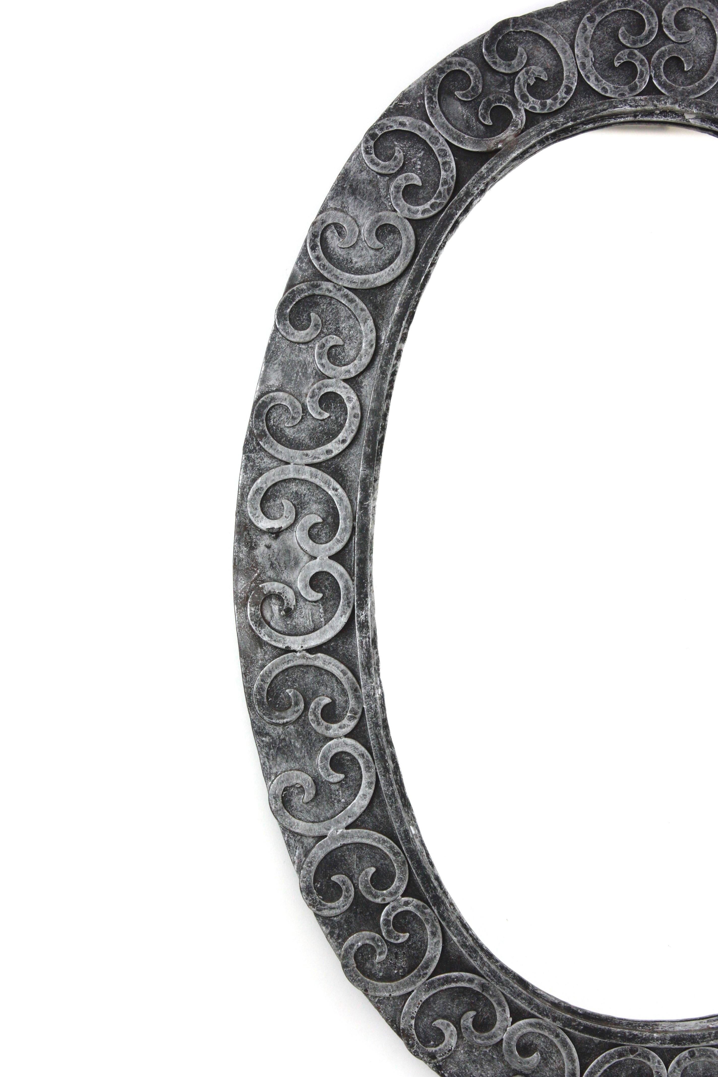 Metal Silvered Brutalist Oval Mirror in Wrought Iron with Scroll Decorations For Sale