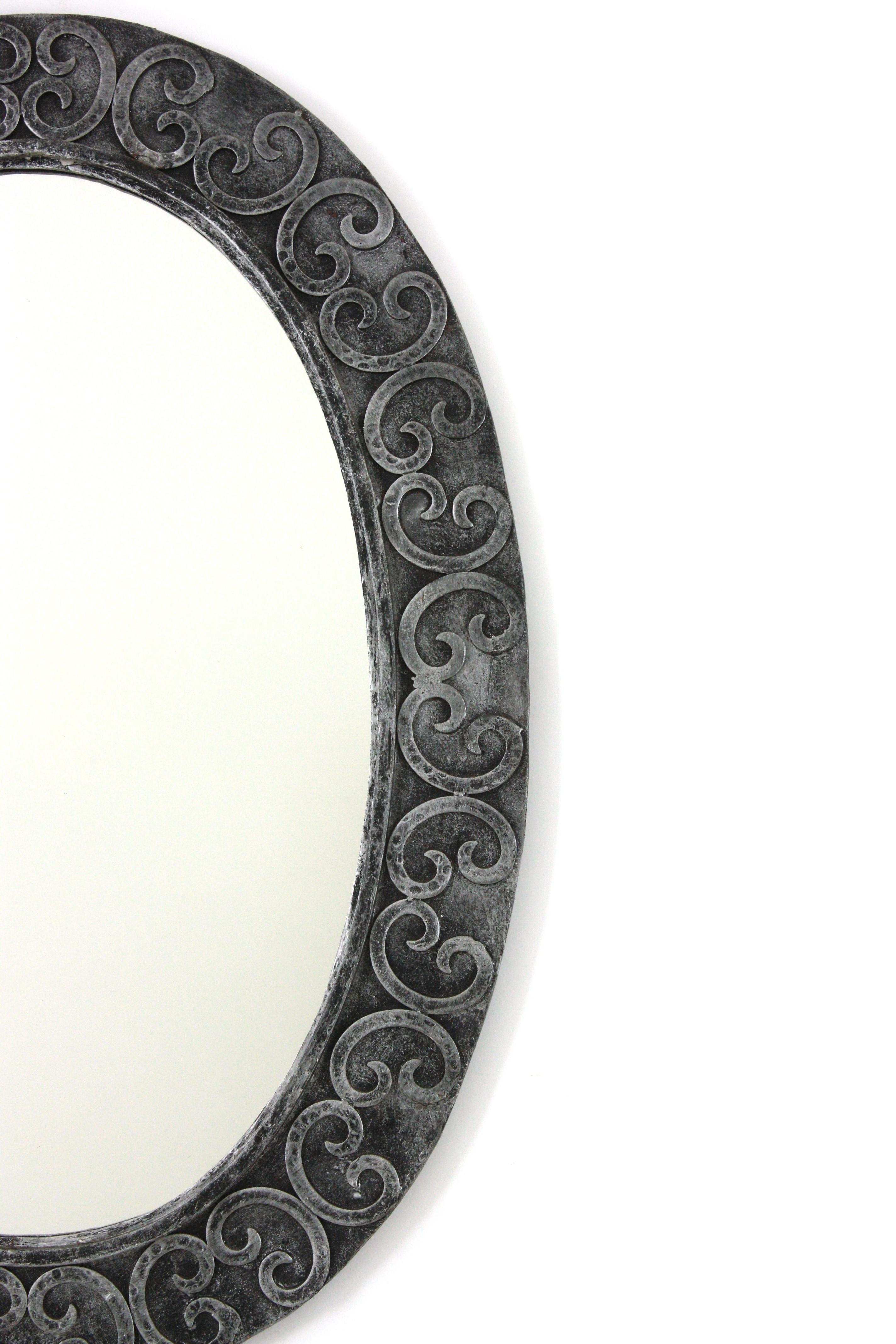 Silvered Brutalist Oval Mirror in Wrought Iron with Scroll Decorations For Sale 1
