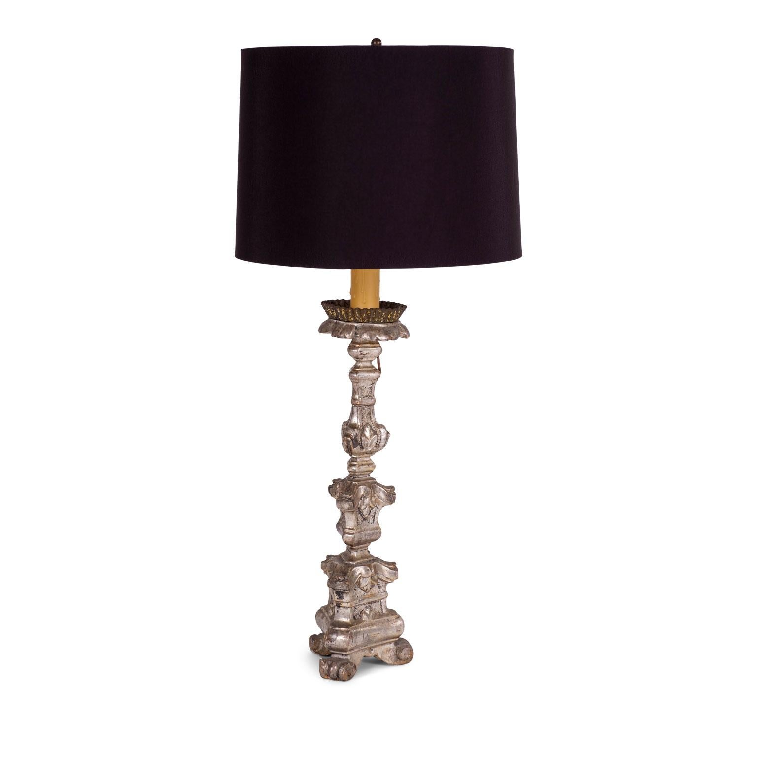 Silvered candlestick lamp: hand carved and silvered Italian candlestick wired as a table lamp with black complementary shade (listed measurements include shade).

Note: Original/early finish on antique and vintage metal will include some, or all, of