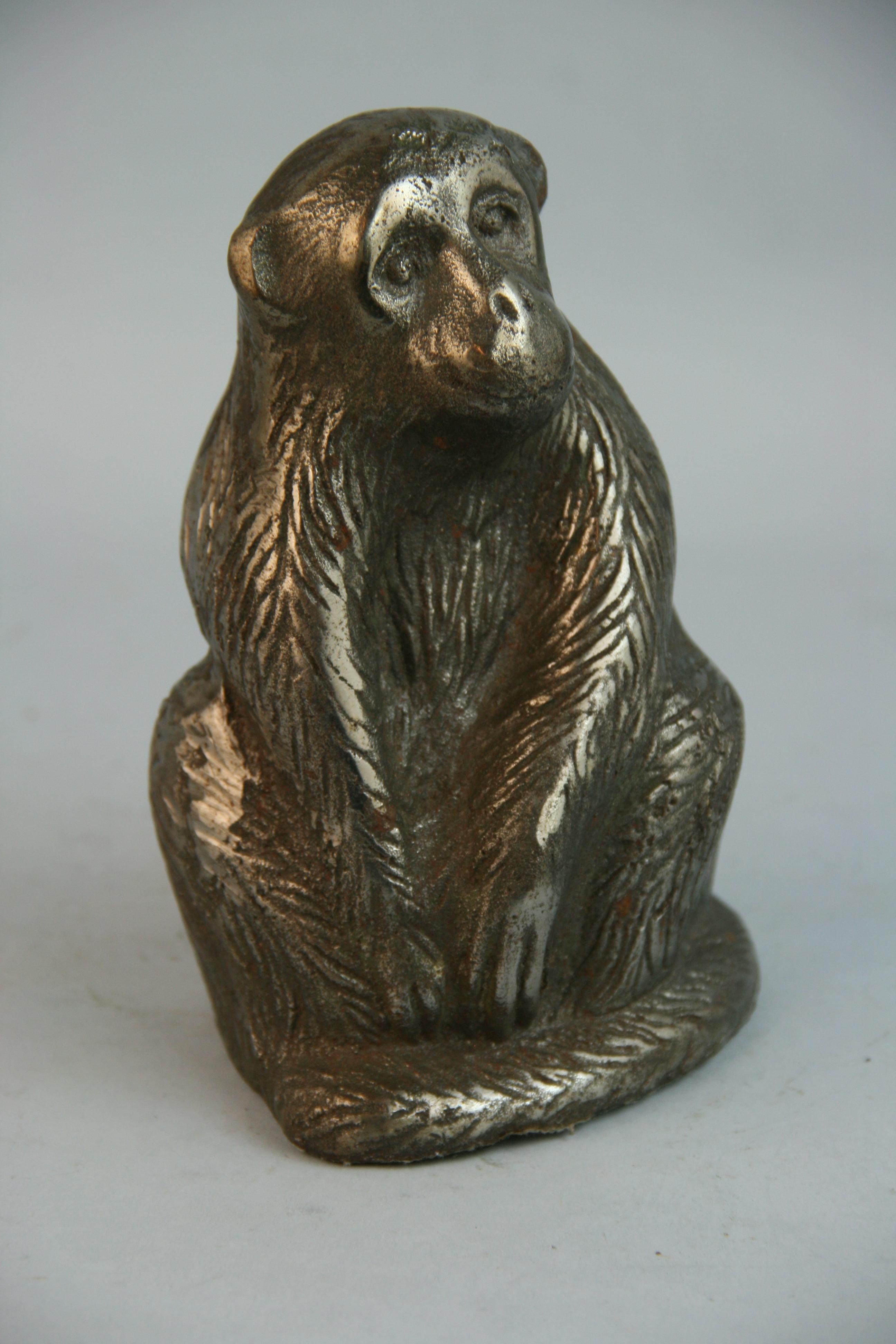 1217 Heavy silvered cast iron finely detailed monkey sculpture / paperweight.