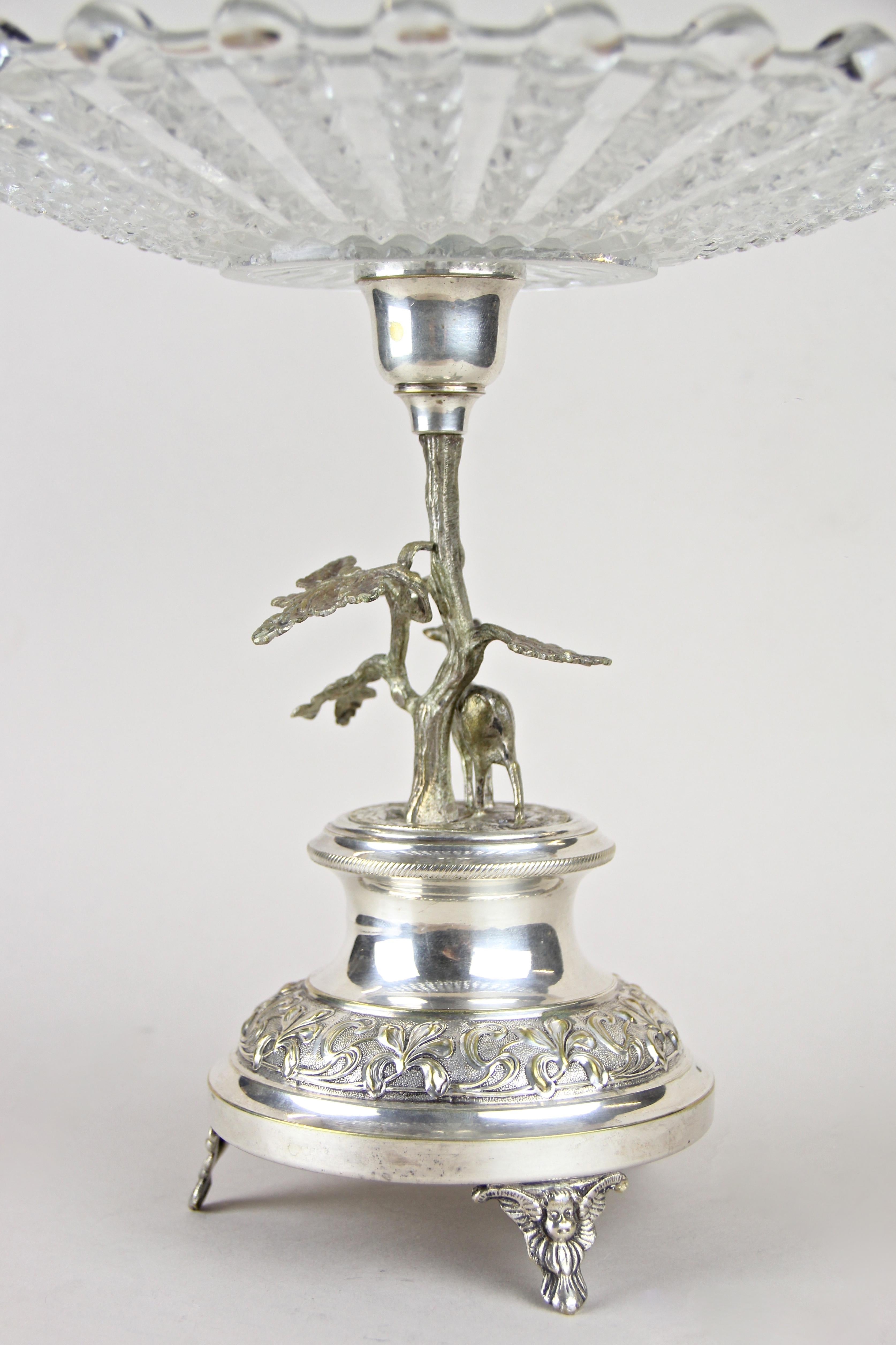 Charming silvered centerpiece out of Austria from the Art Nouveau period, circa 1910. The beautiful pressed glass plate sits on an artful handcrafted silvered brass base depicting a small deer figurine under a tree. A real lovely Centerpiece from