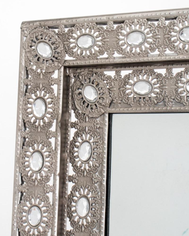Silvered Filigreed Metal and Faux Gem-Set Full-Length Mirror, rectangular, the elaborate stepped frame set with navette shaped faceted rhinestones with a rear support. It is a free standing mirror and does not require wall mounting. Dimensions: