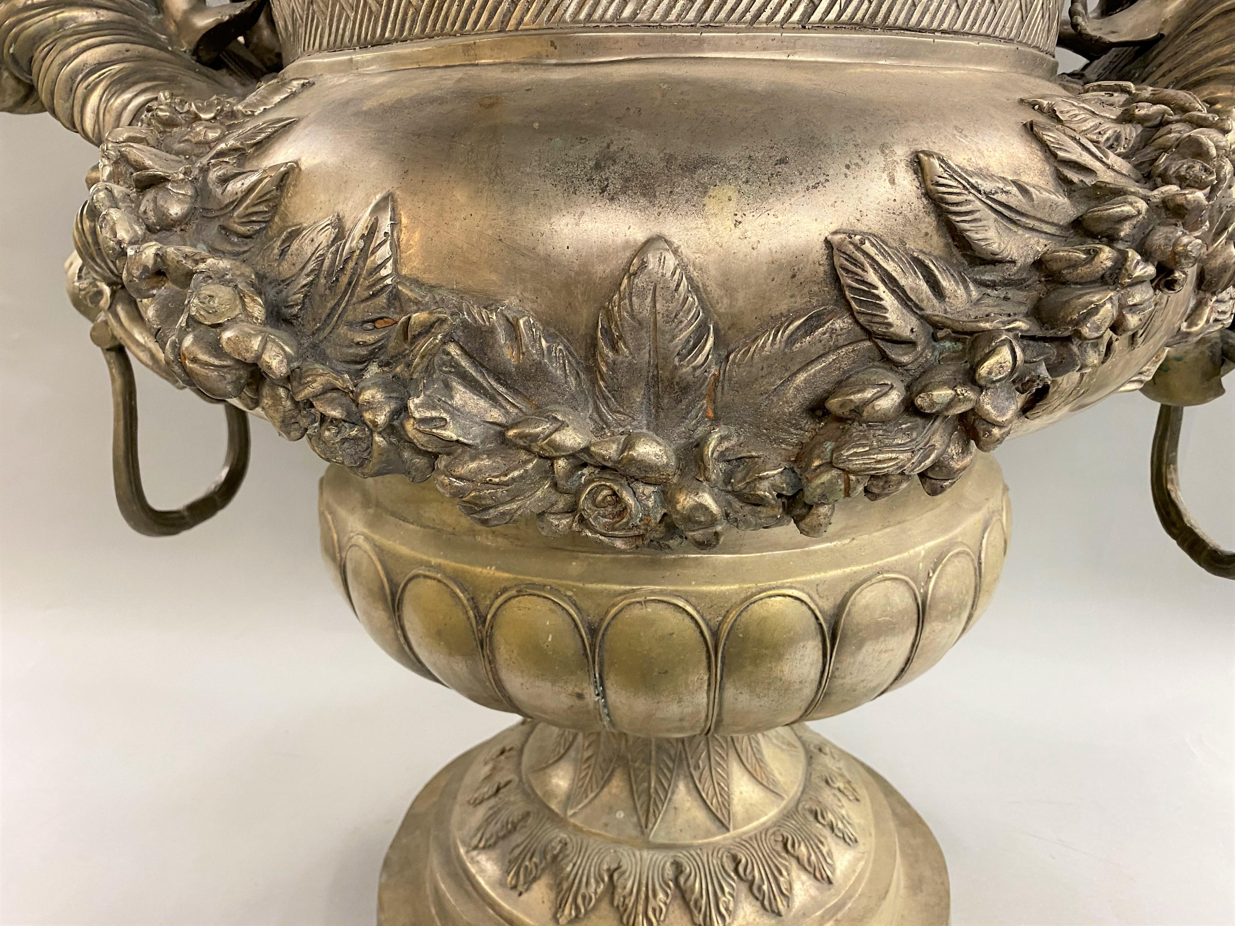 American Silvered Metal Handled Garden Urn with Lion Heads and Winged Putti