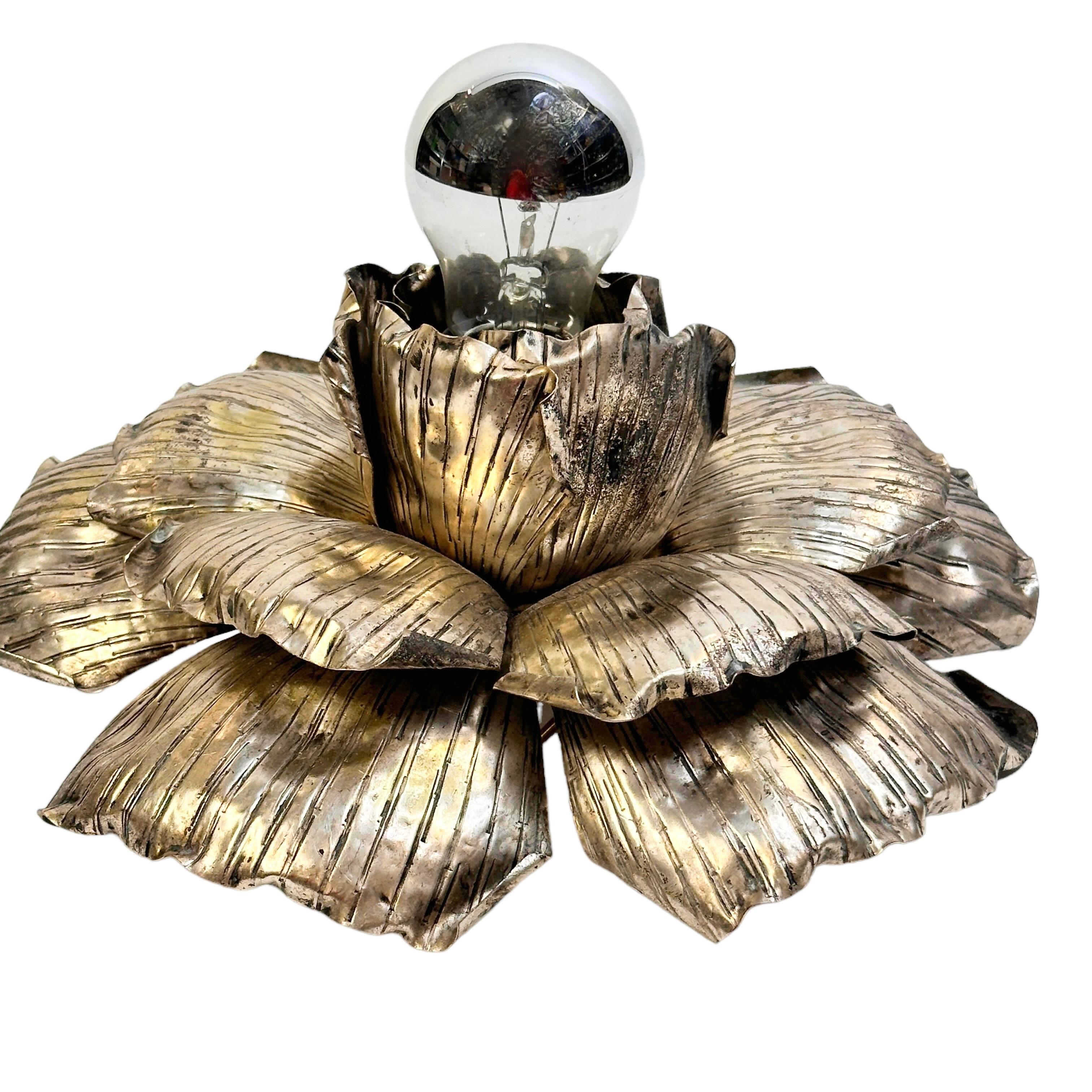 Add a touch of opulence to your home with this charming flush mount or wall light. Perfect stunning distressed silvered flower design to enhance any chic or eclectic home. We'd love to see it hanging in an entryway as a charming welcome home. You