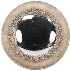 Miroir convexe en résine argentée et verre ancien.