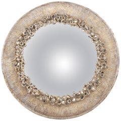 Miroir convexe en résine argentée et verre ancien.
