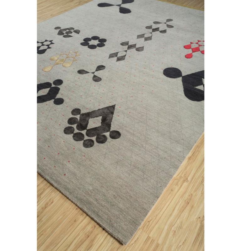 Get ready to be swept off your feet by this exquisite handcrafted luxury rug from our Kolam collection. Your floor deserves to make a statement, and boy, does this handmade rug know how to do it! This rug is a visual masterpiece that unfolds like a
