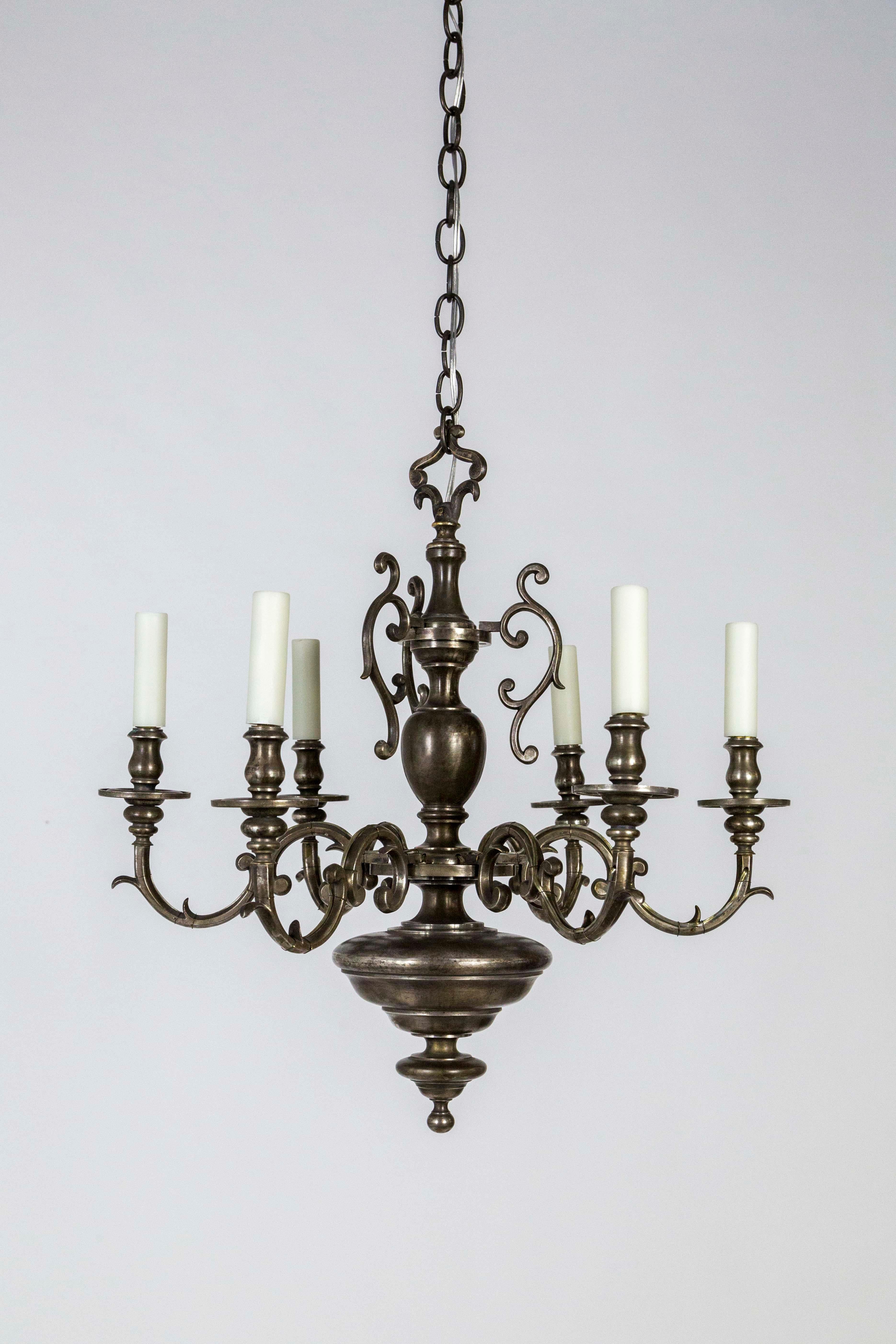 A Dutch, Baroque style, 6-arm chandelier created circa 1900, a beautifully crafted, solid bronze piece with an antique silver finish. Newly wired. Measures: 24.5” height x 25.5