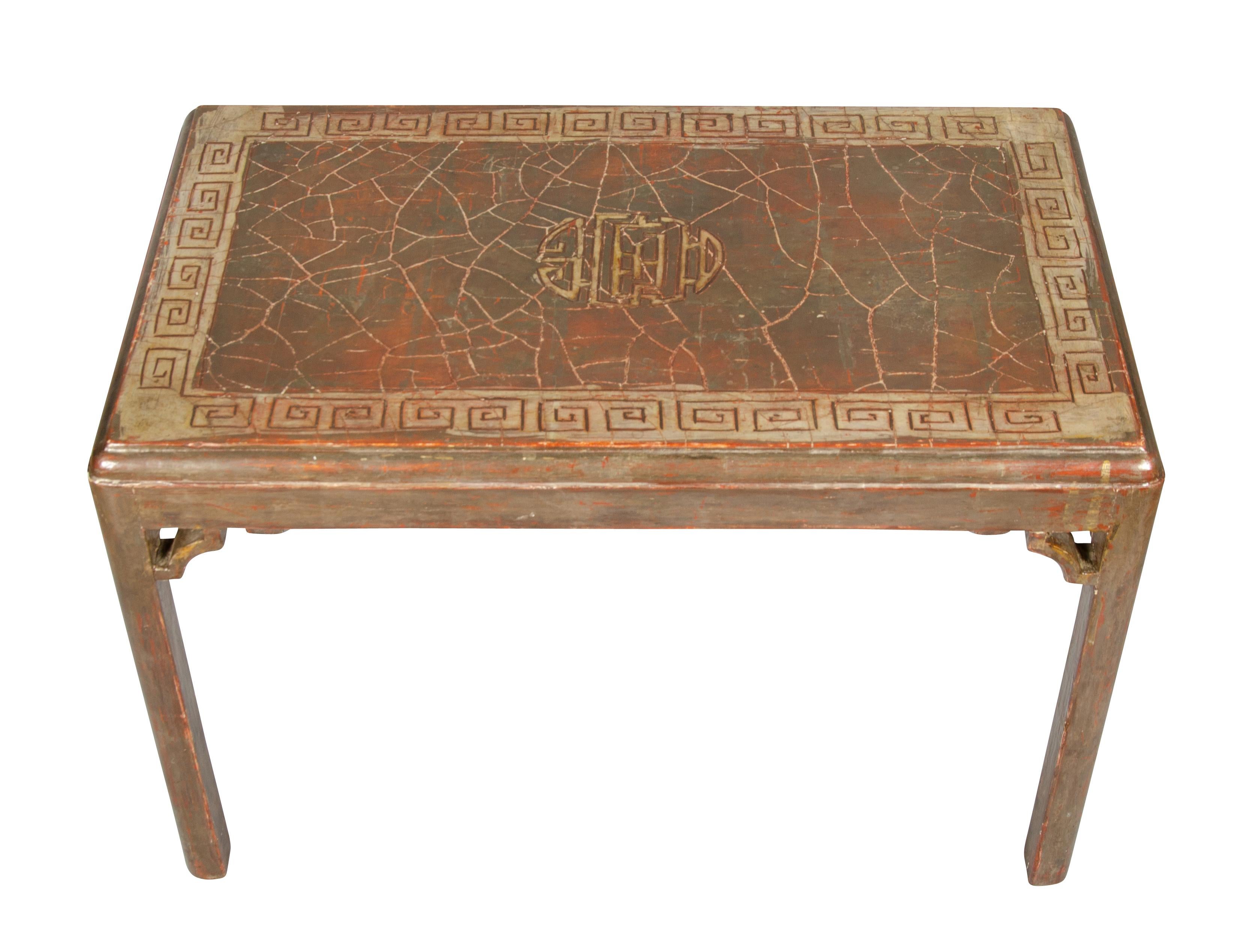 Rectangular top with Asian inspired decoration, raised on square section legs with spandrels.