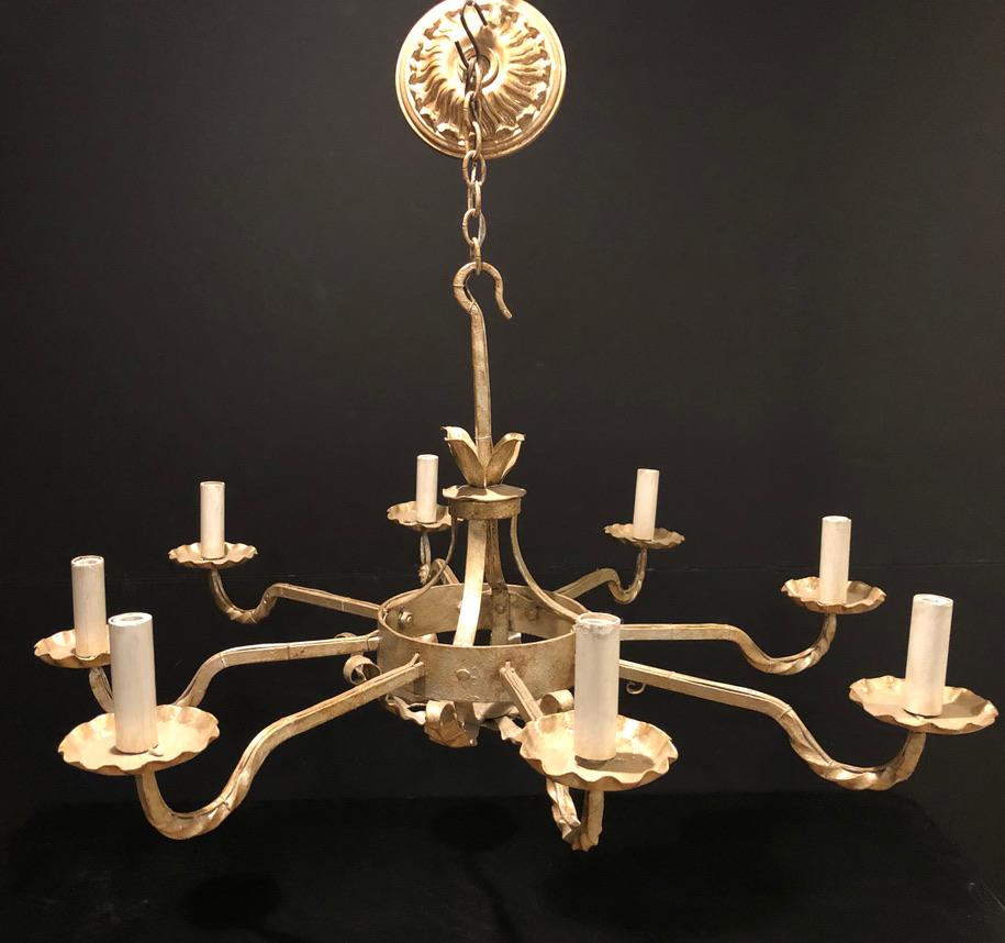 19th century silvered handwrought iron country/provincial French chandelier. Clean simple lines 8 light/arm with twisted arms and turned leaf bottom. Measures: 22