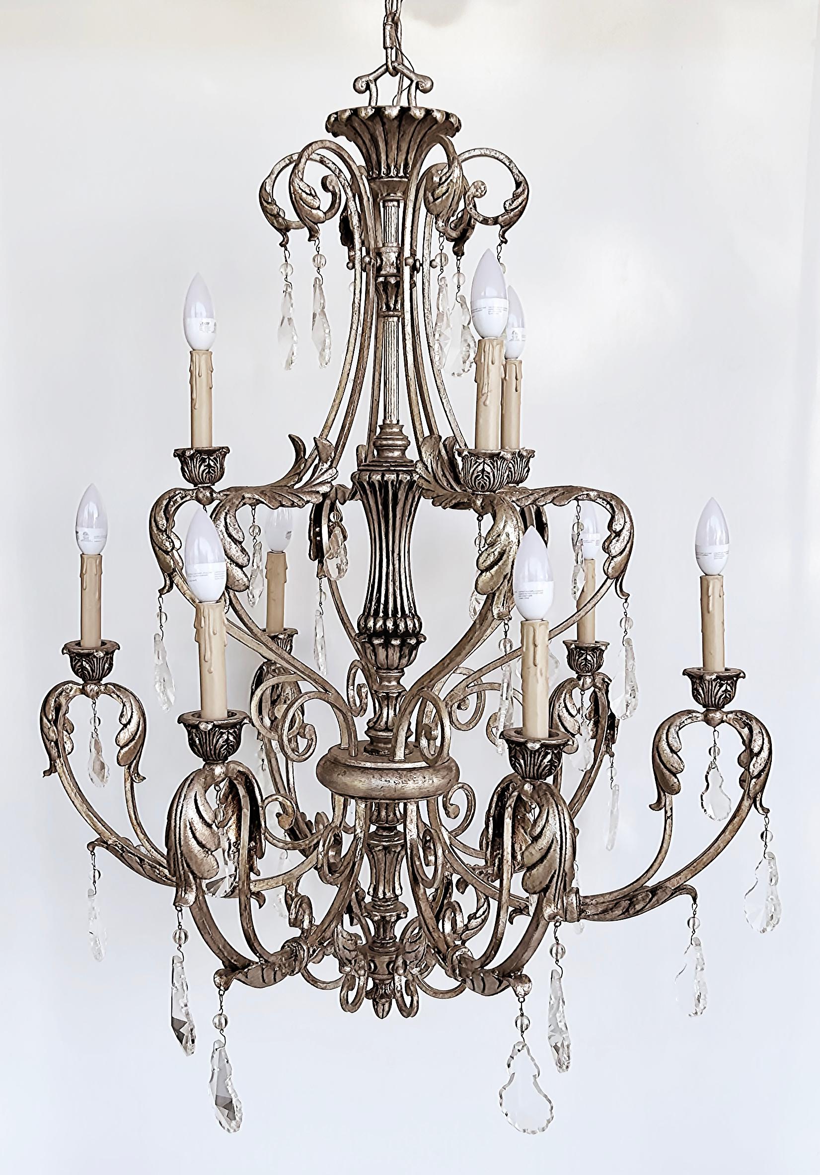 Silvered Wrought Iron Crystal 9 Arm Chandelier, Original Canopy

Offered for sale is a silver leaf wrought iron chandelier with nine arms and crystals. The chandelier is a recent find from a Miami Beach waterfront island home. The large scale of