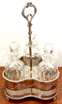 Silverplated Tantalus, John Sherwood & Sons, 3 Optical Cut Glass Decanters, 1900