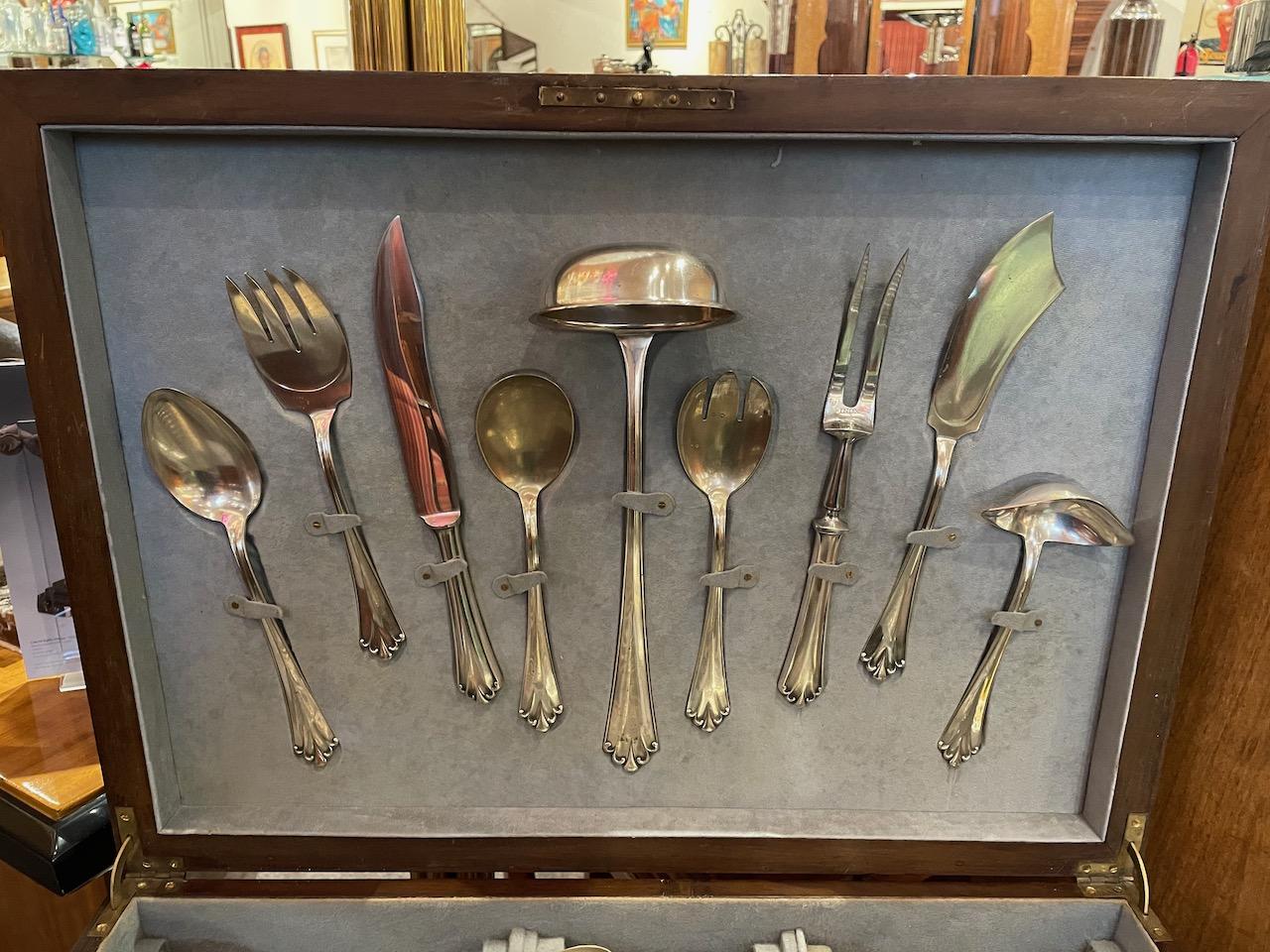 A set of silverware – in a lavishly complete service for 12 that includes a wide array of serving pieces all nestled in a fitted chest that also is used as a small table. Made in the the1920s and imported from France, the case is done in a sleek Art