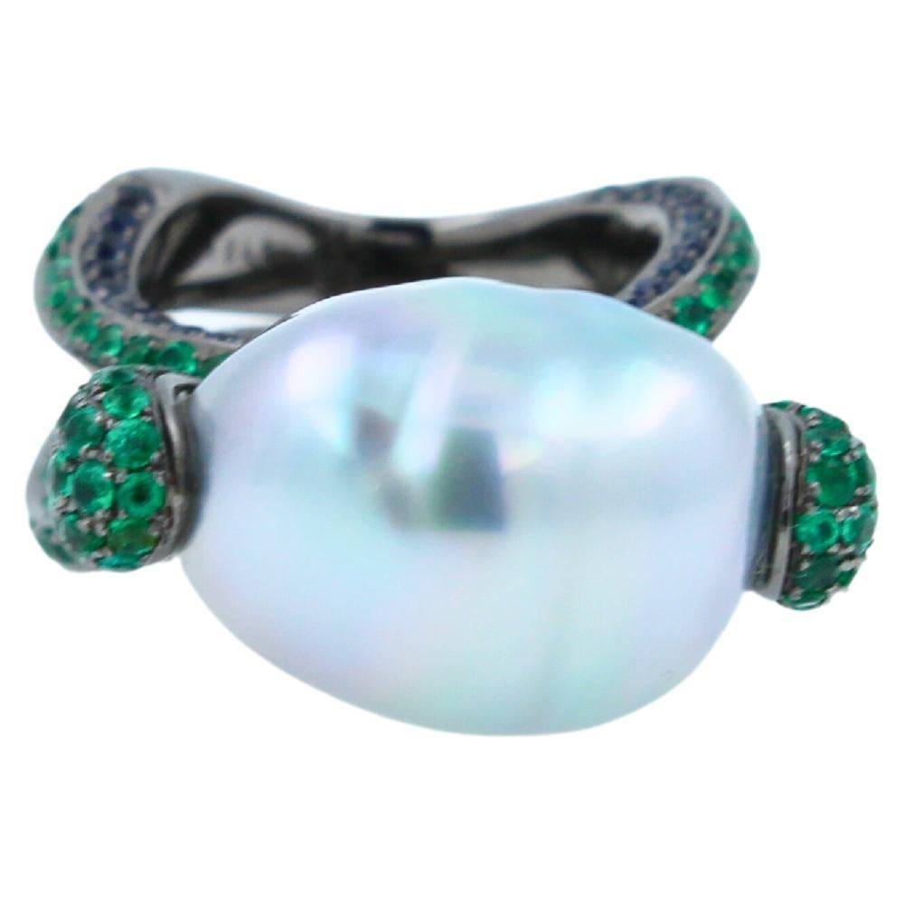 12.15 Carats Beautiful Silvery White Iridescent South Sea Pearl
16.50 x 13.50 mm Elongated Egg Oval Shape South Sea Pearl Size
AAA Quality Extremely Beautiful, Captivating Pearl 
High-End, Luxury Crafting & Finish
Green Emeralds Pave: 3.00 ctw
Blue