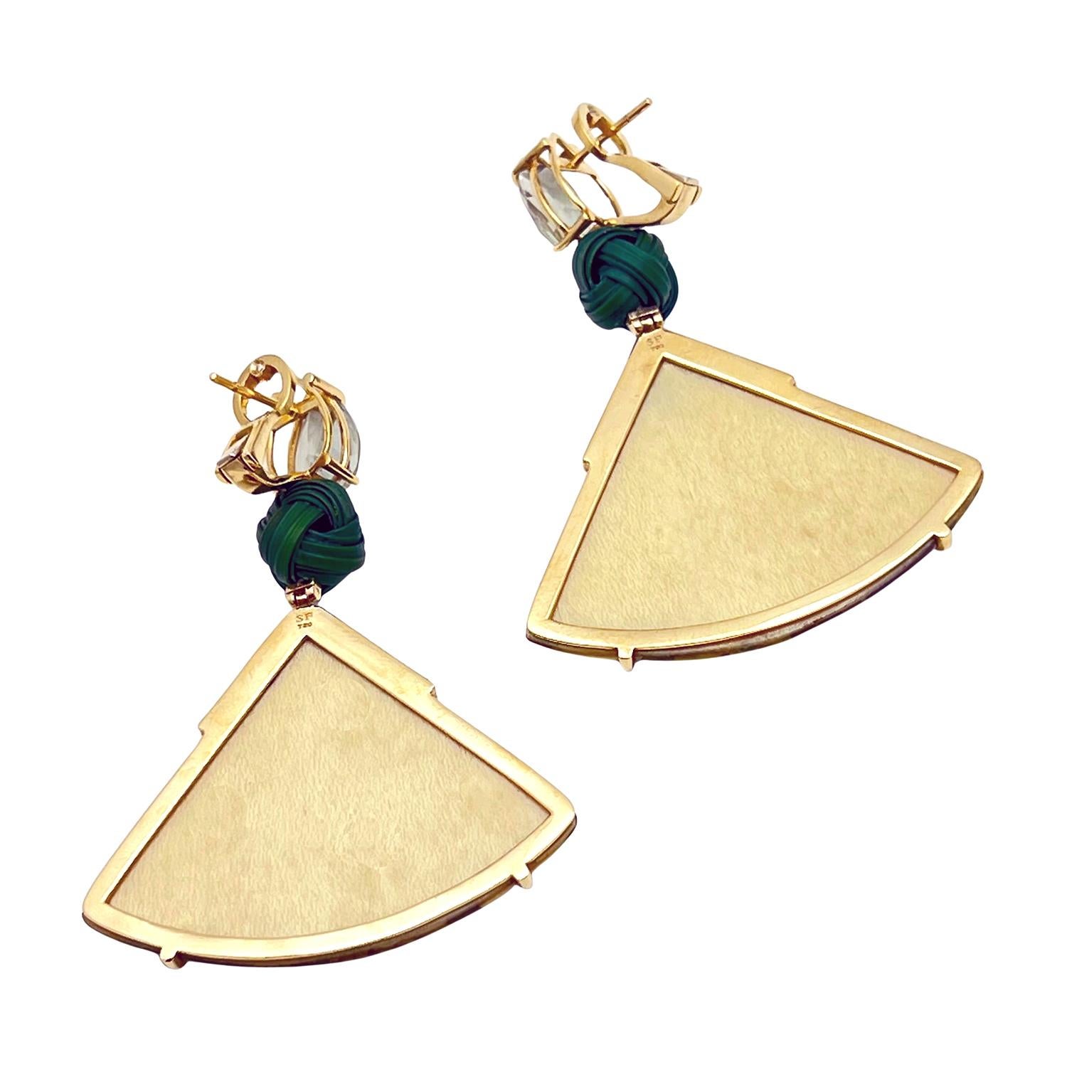 Marquetry earrings in 18k yellow gold and aquamarine by Brazilian designer Silvia Furmanovich.  The drop design earring is hand crafted in gold with a prong set, pear shape, faceted natural aquamarine. A green bamboo knot joins the fan shape
