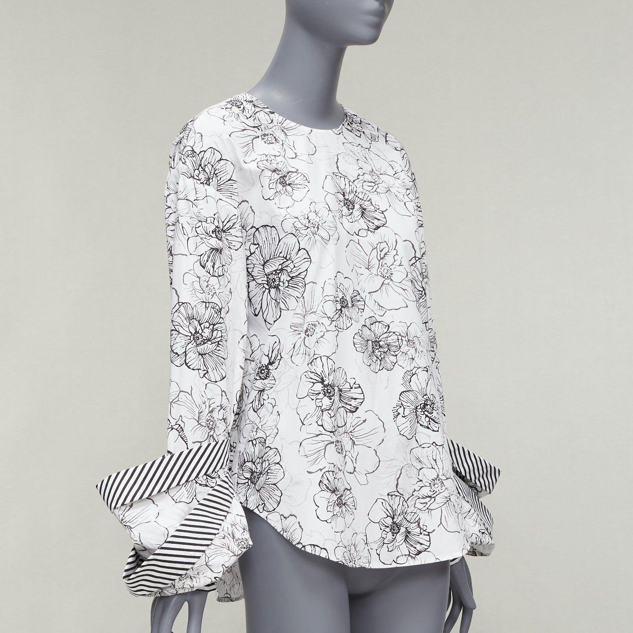 SILVIA TCHERASSI Jessica white floral print tiered cuff crew neck top S
Reference: AAWC/A00669
Brand: Silvia Tcherassi
Model: Jessica
Material: Cotton
Color: Black, White
Pattern: Floral
Closure: Button
Extra Details: lack and white cotton Jessica
