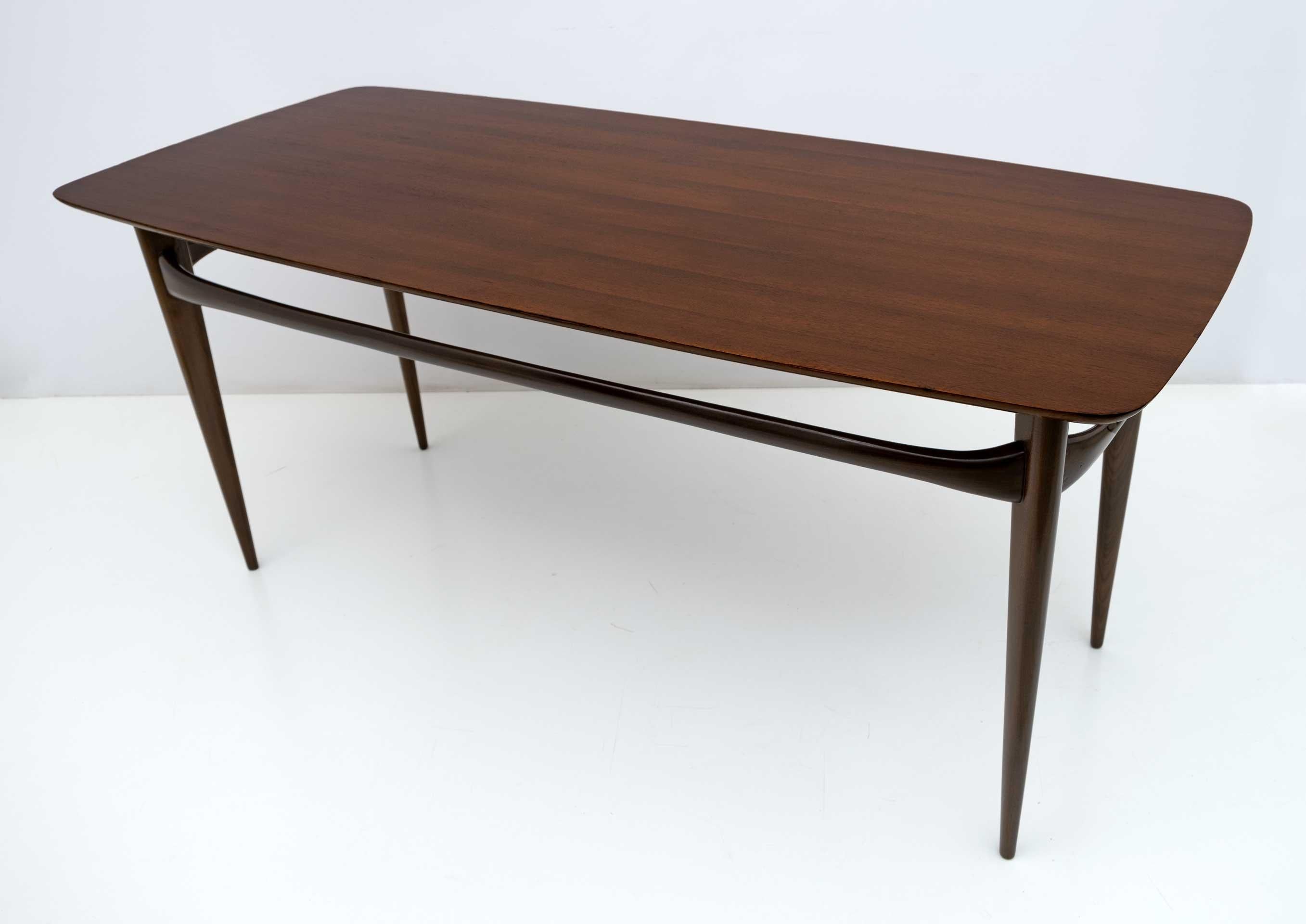 Mahogany table designed by Silvio Cavatorta in the 60s. Completely restored and polished with shellac