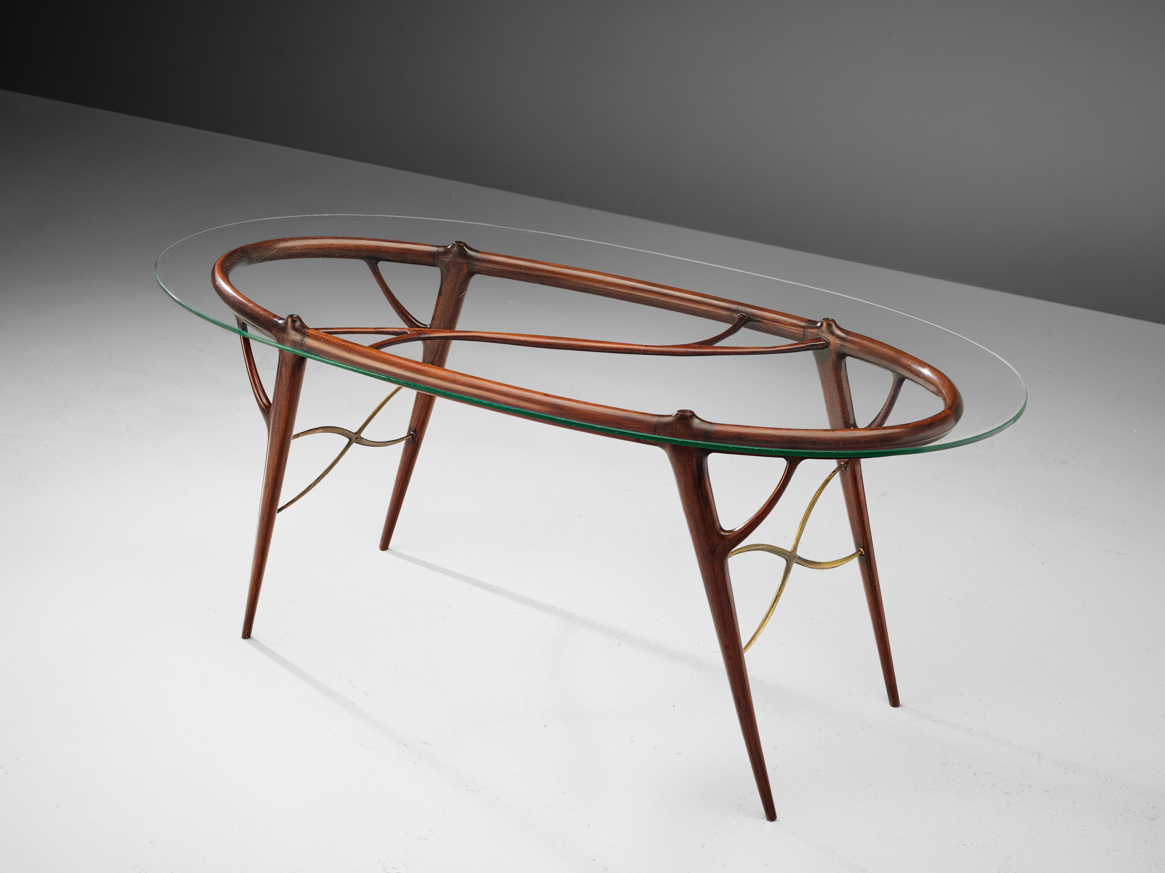 Dining table, mahogany, brass, glass, Italy, 1950s

This highly elegant dining table with oval glass table top strongly reminds of the creations of the Italian designer Silvio Cavatorta. The delicate frame in mahogany consists of organic, branche