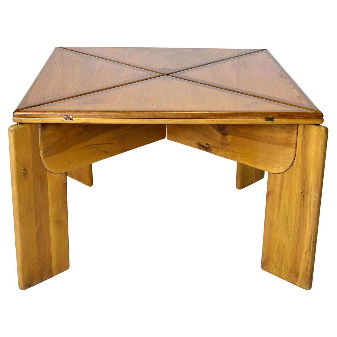 Square extensible walnut table designed by Silvio Coppola for Bernini production 1970s.
The measurements of the open table become W 155 D 155 H 70.5 cm

Graduated in Architecture from the Milan Polytechnic.As an architect, he made buildings in