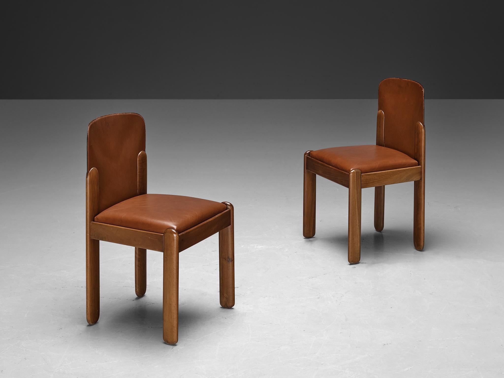 Silvio Coppola for Bernini, dining chairs, model '330', cognac brown leather, walnut, Italy, 1969

Wonderful duo of dining chairs in cognac leather and walnut wood by Italian designer Silvio Coppola. These aesthetically well balanced chairs strongly