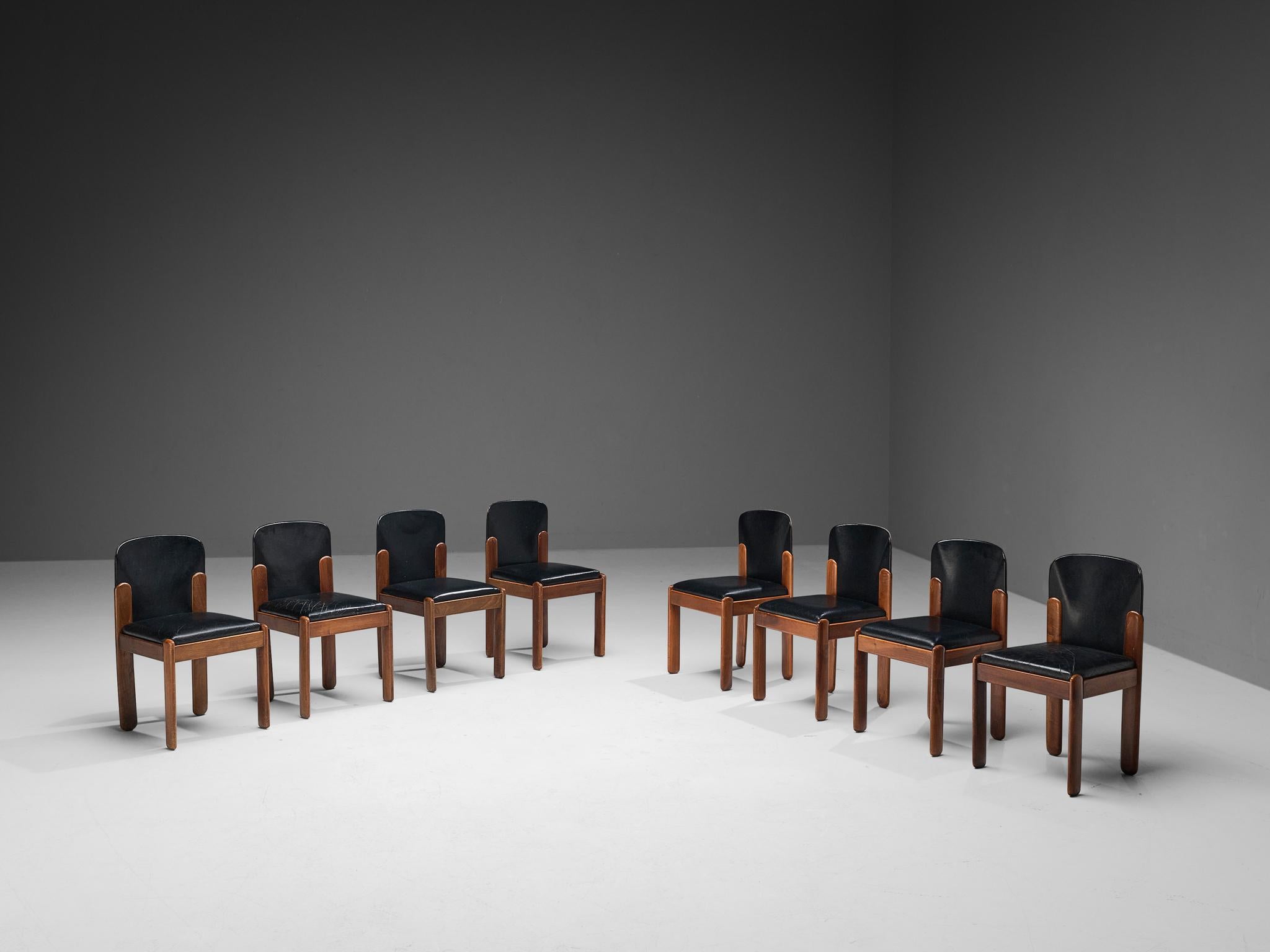 Silvio Coppola for Bernini, set of eight dining chairs model 330, black leather, walnut, Italy, 1960s.

Wonderful set of eight dining chairs by Italian designer Silvio Coppola. These aesthetically well balanced chairs strongly convince with the