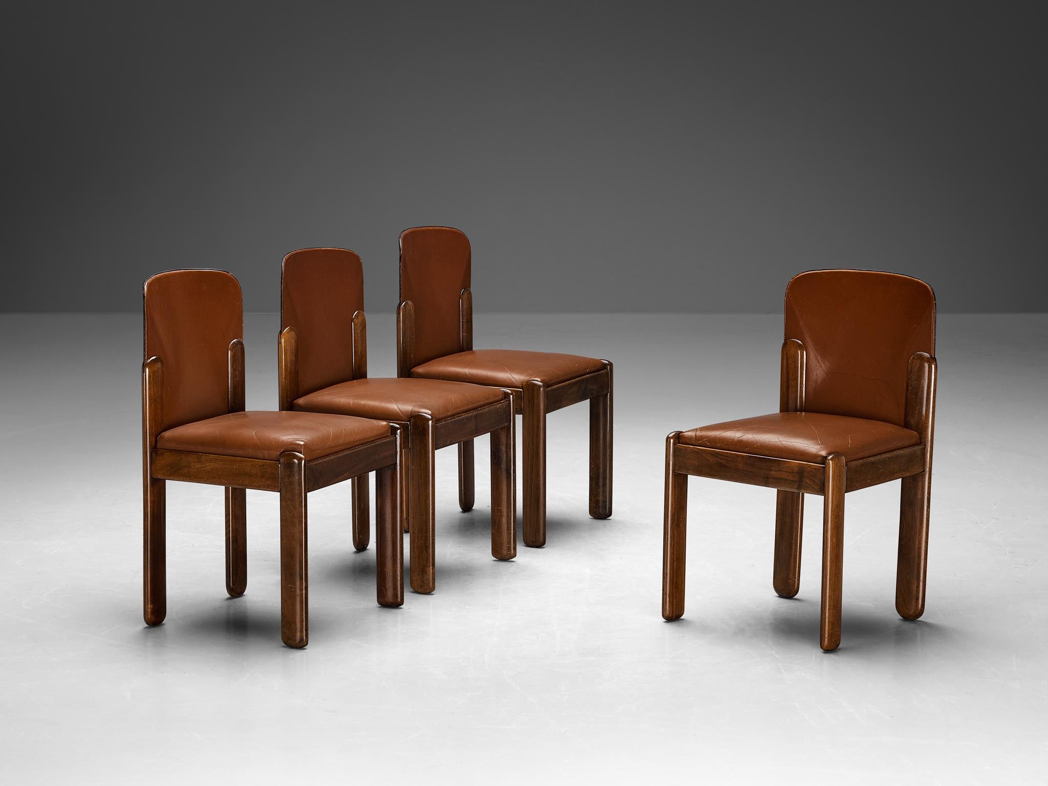 Silvio Coppola for Bernini, set of four dining chairs model 330, leather, walnut, Italy, 1960s.

This magnificent set of dining chairs by the renowned Italian designer Silvio Coppola is a remarkable display of aesthetic harmony, distinguished by a