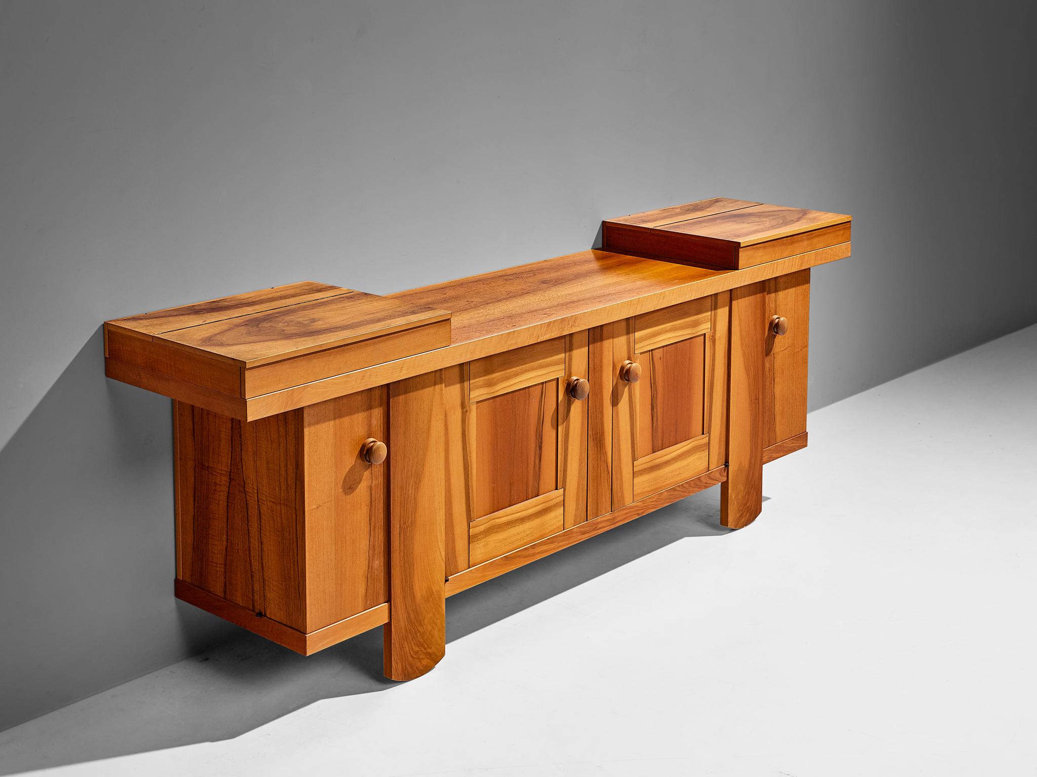 Silvio Coppola for Bernini, sideboard, walnut, Italy, 1960s

This impressive sideboard or credenza was designed by Silvio Coppola. It is well-structured with different compartments to store your belongings. Two doors in the middle and two corner