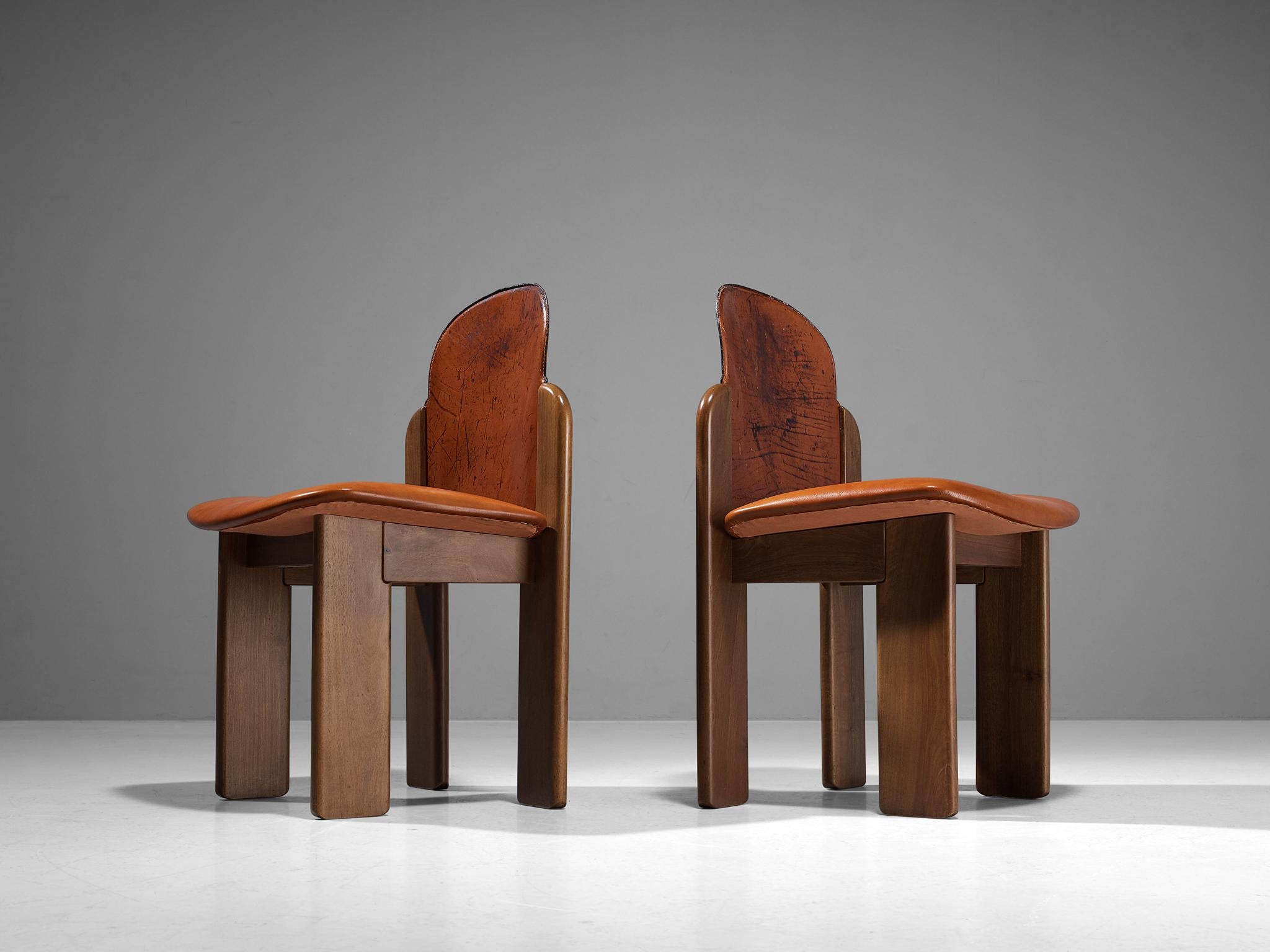 Silvio Coppola for Fratelli Montina, '330' dining chairs, walnut, leather, Italy, 1970s

Stunning organic looking dining pair of chairs by Italian designer Silvio Coppola. These chairs are made in walnut wood and a beautifully patinated leather in a