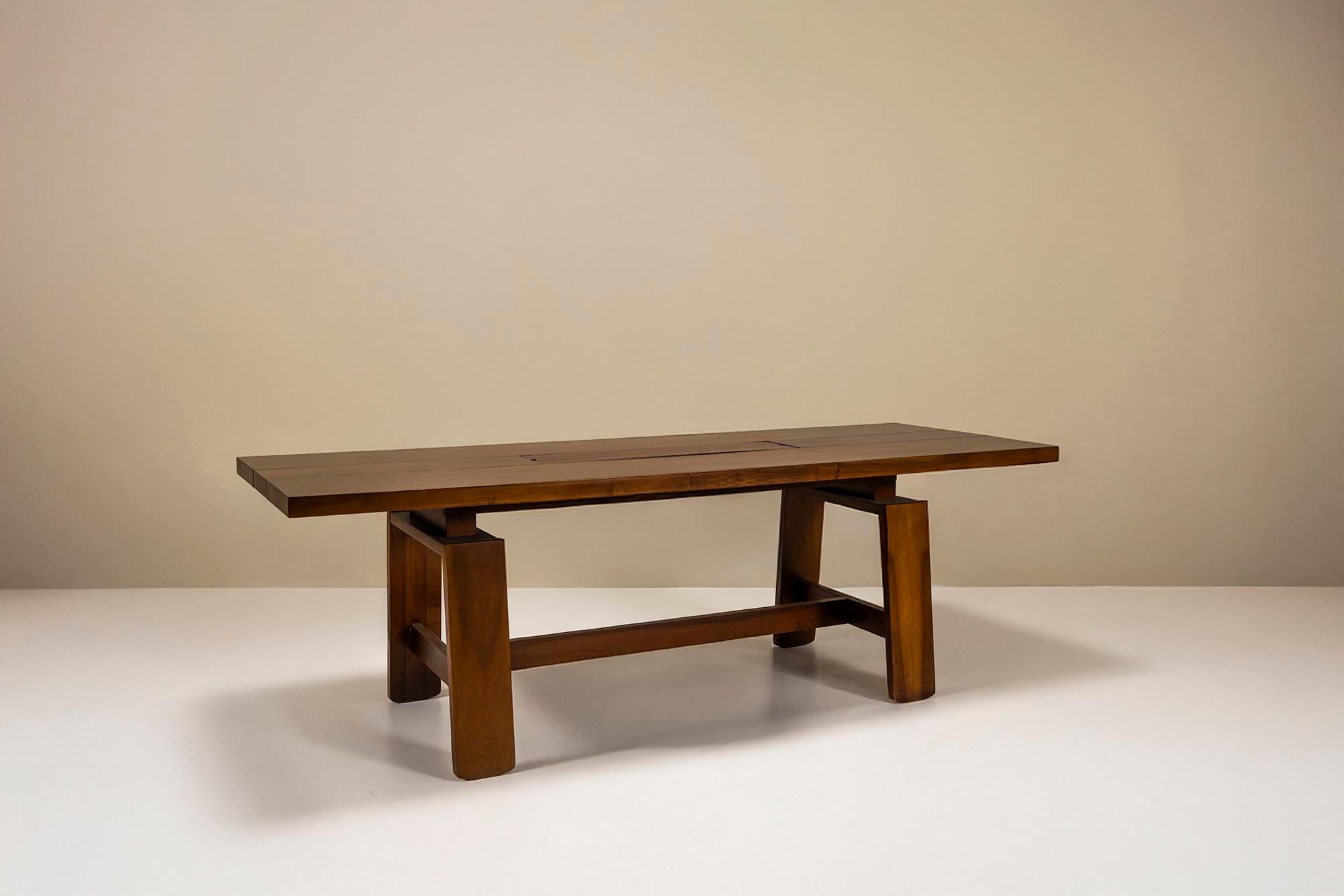 Silvio Coppola brought a clear architectural sensibility to his furniture designs. Coppola approached furniture design much like an architect—prioritizing structure, function, and honest materials over decoration. This Mod. 611 dining table,