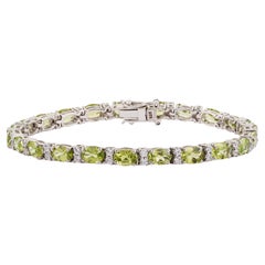 Bracciale tennis Silvorra con peridoto ovale da 10,95 ct e diamanti da 1,1 ct, in argento massiccio