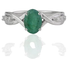 Silvorra Esmeralda ovalada de 1,34 ct y diamante Anillo de Infinito Torcido en Plata 925