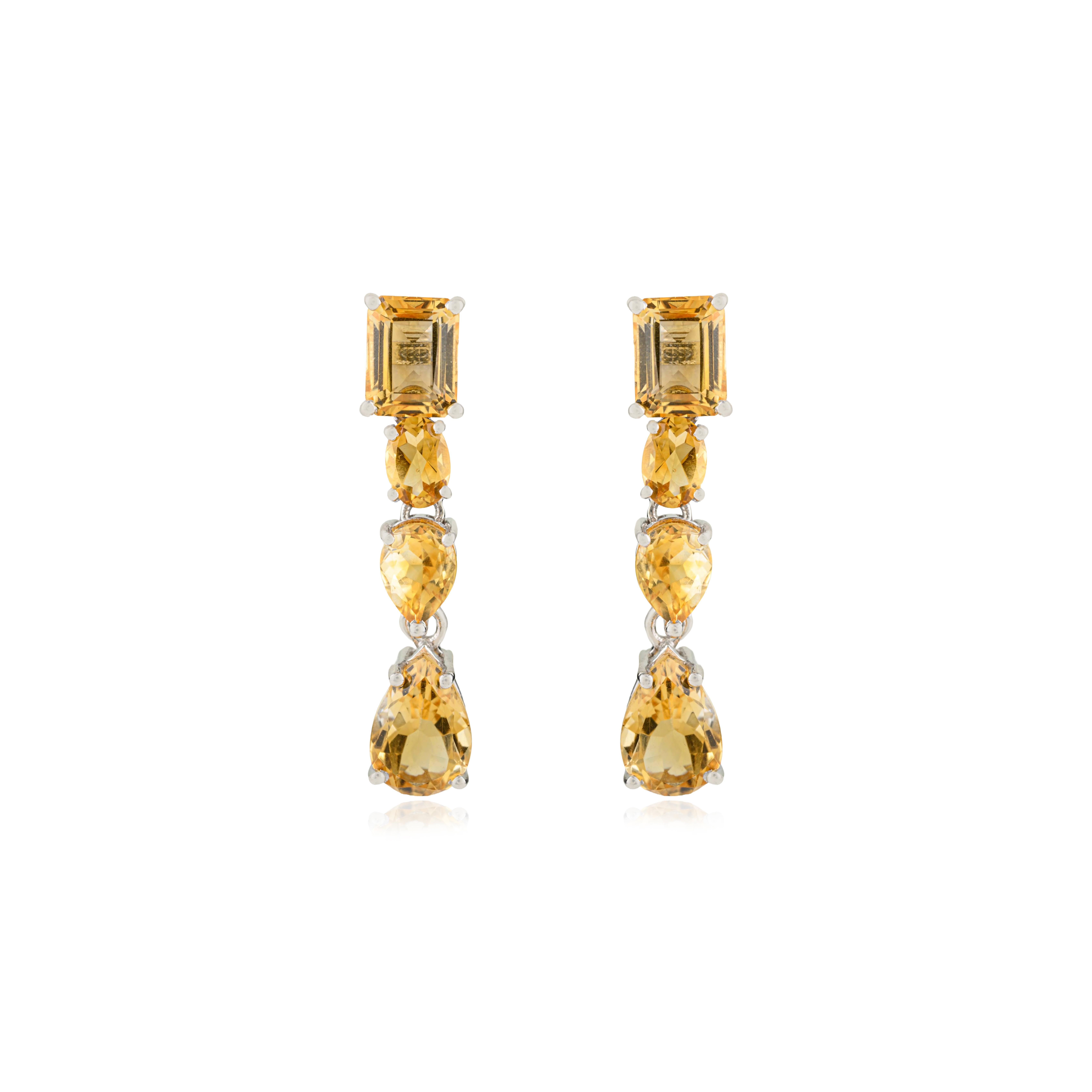Radiating golden brilliance, these Silvorra 925 sterling silver earrings feature eight natural citrine gemstones in a stunning mix of shapes and sizes. With a total gemstone weight of 14.55 carats, the citrines exude a warm, sunlit glow that