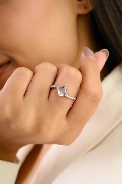 Silvorra 925 Sterling Silver Aquamarine Solitaire Ring with White Zircon Accents