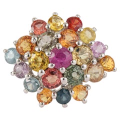 Silvorra Ring aus 925er Sterlingsilber mit gewölbter Steinfassung und mehreren Saphiren im Rundschliff