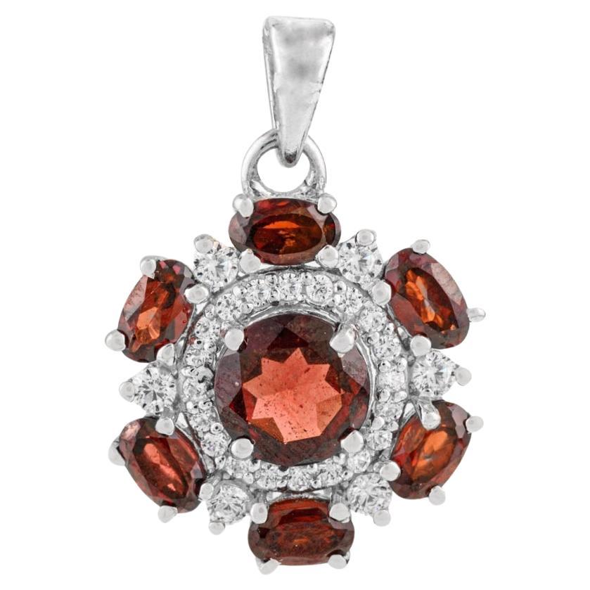 Ciondolo a forma di fiore in argento 925 di Silvorra con granato e zircone scintillante