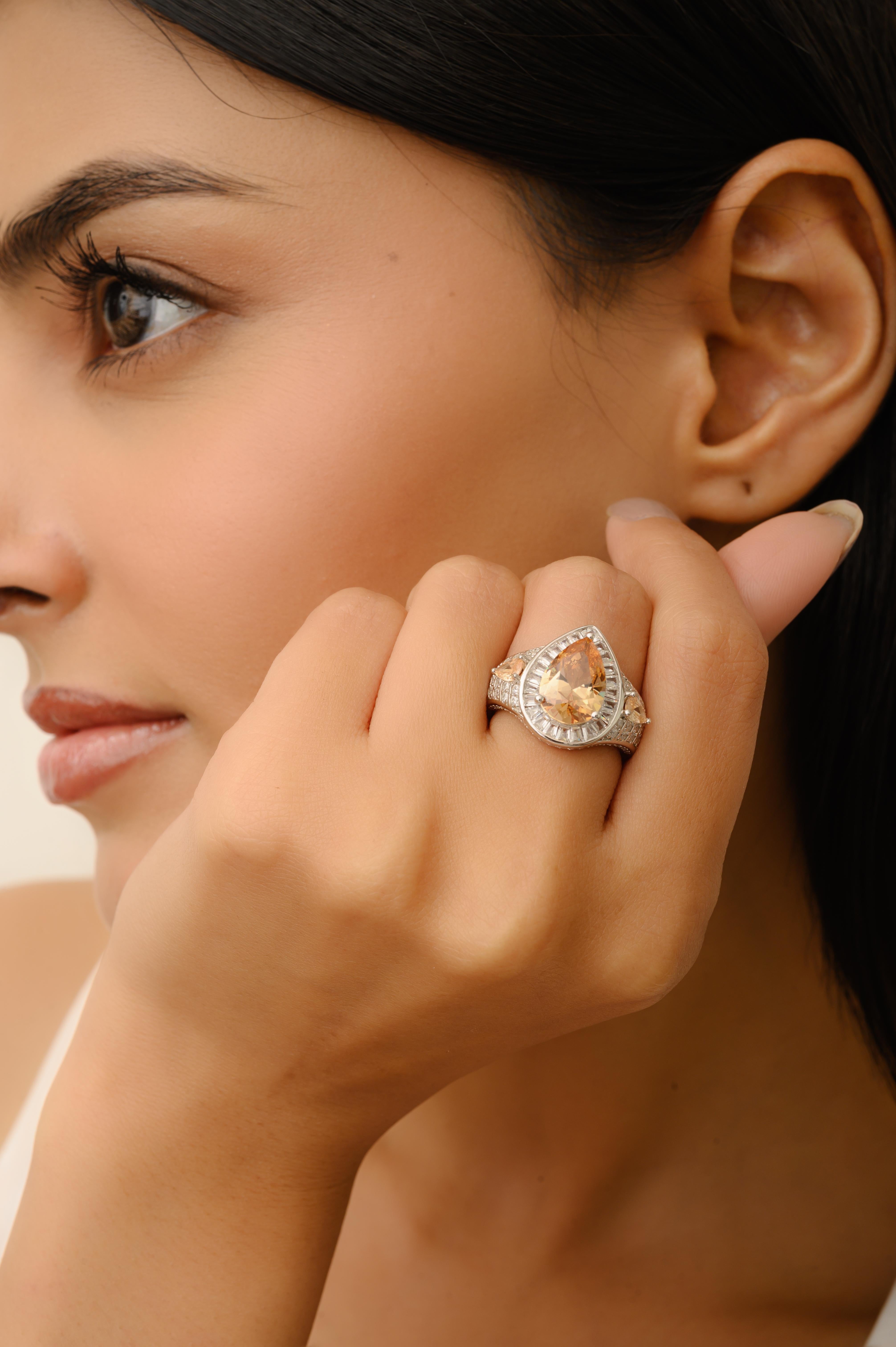 in vendita:  Anello aureola con zirconi bianchi e arancioni a forma di pera in argento Sterling 925 Silvorra 9