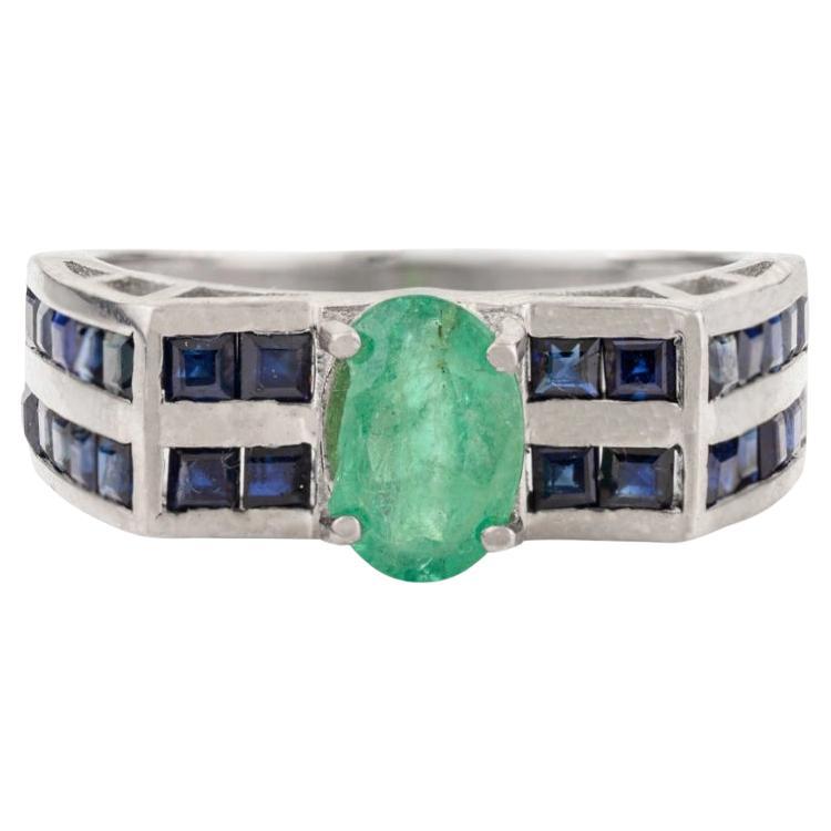 For Sale:  Silvorra Art Deco Oval-Cut Emerald Cluster Ring in with Sapphire Channel Accents