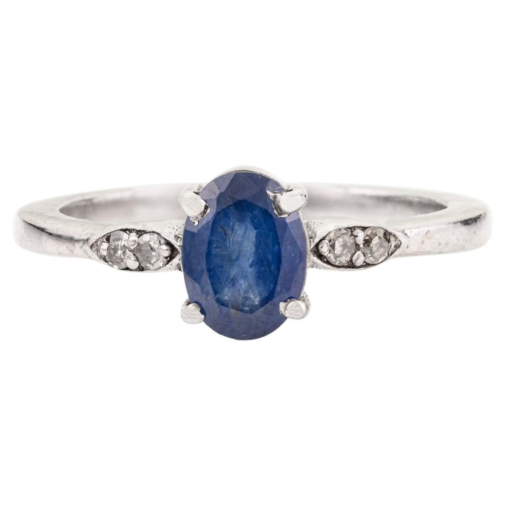 For Sale:  Silvorra Classic Four Prong Oval Cut Blue Sapphire Solitaire Ring with Diamond