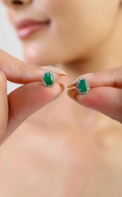 Silvorra Elegant Oval-Cut Emerald Cluster Stud Earrings in Halo Diamonds for Her