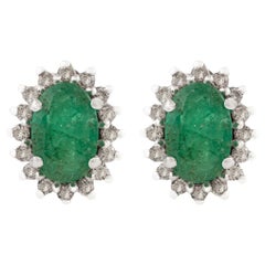 Silvorra Elegant Oval-Cut Emerald Cluster Stud Earrings in Halo Diamonds for Her