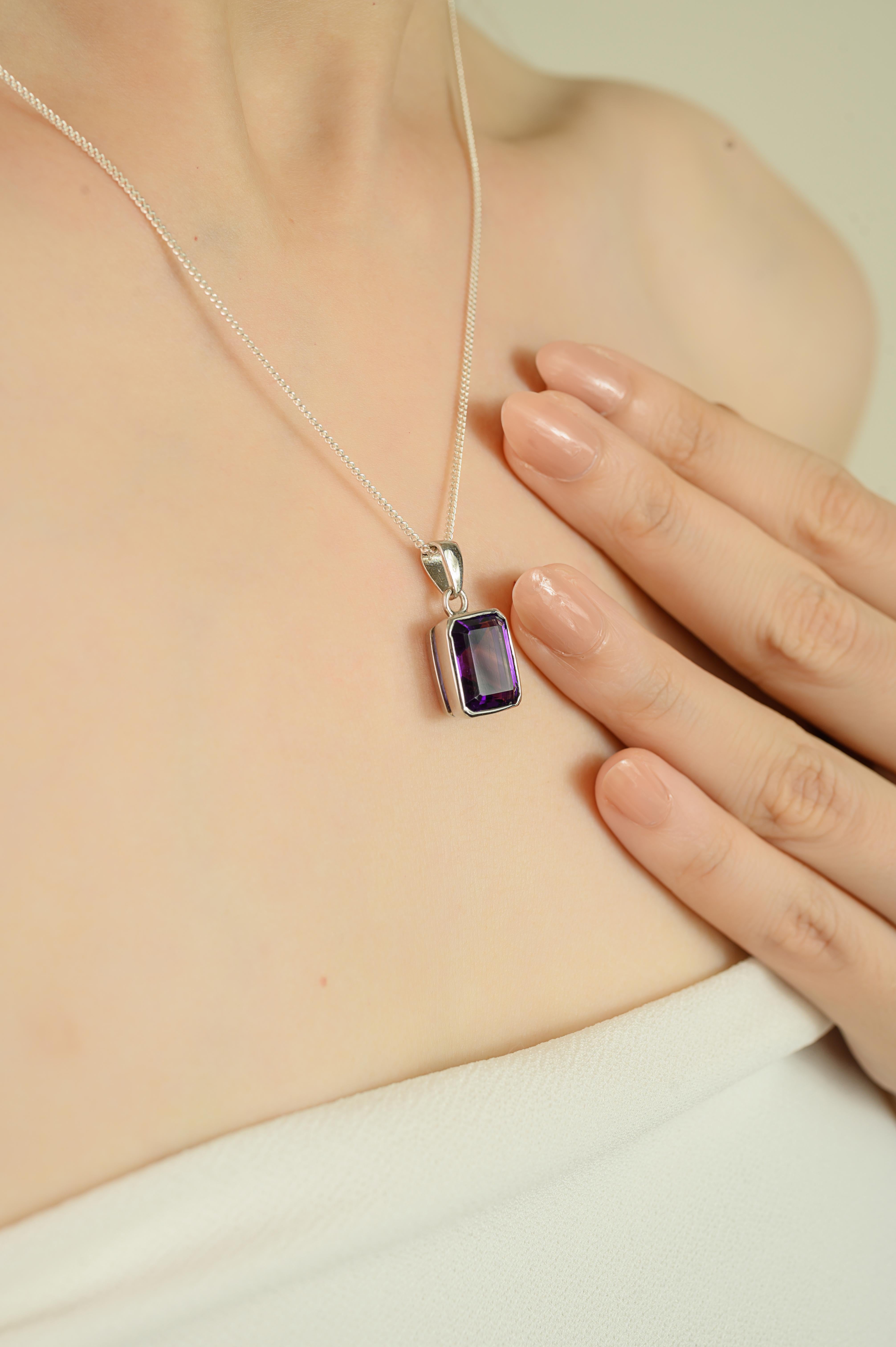 This pendant is crafted in 925 sterling silver and features a natural octagon shaped amethyst measuring 11x9 mm and weighing 5.76 carats. The stone is securely bezel set and the pendant has a total weight of 3 grams. Measuring 0.86 inches in length,