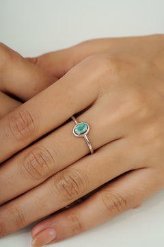 Silvorra Oval Cut Emerald Solitaire Floating Halo Ring in 925 Sterling Silver