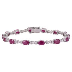 Silvorra Oval Cut Ruby & Diamond Tennis Bracelet with Silver Infinity Wave Links