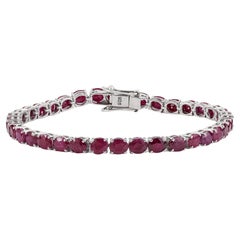 Silvorra Sleek Tennis Bracelet with Oval Cut Dark Ruby Gemstones in Solid Silver