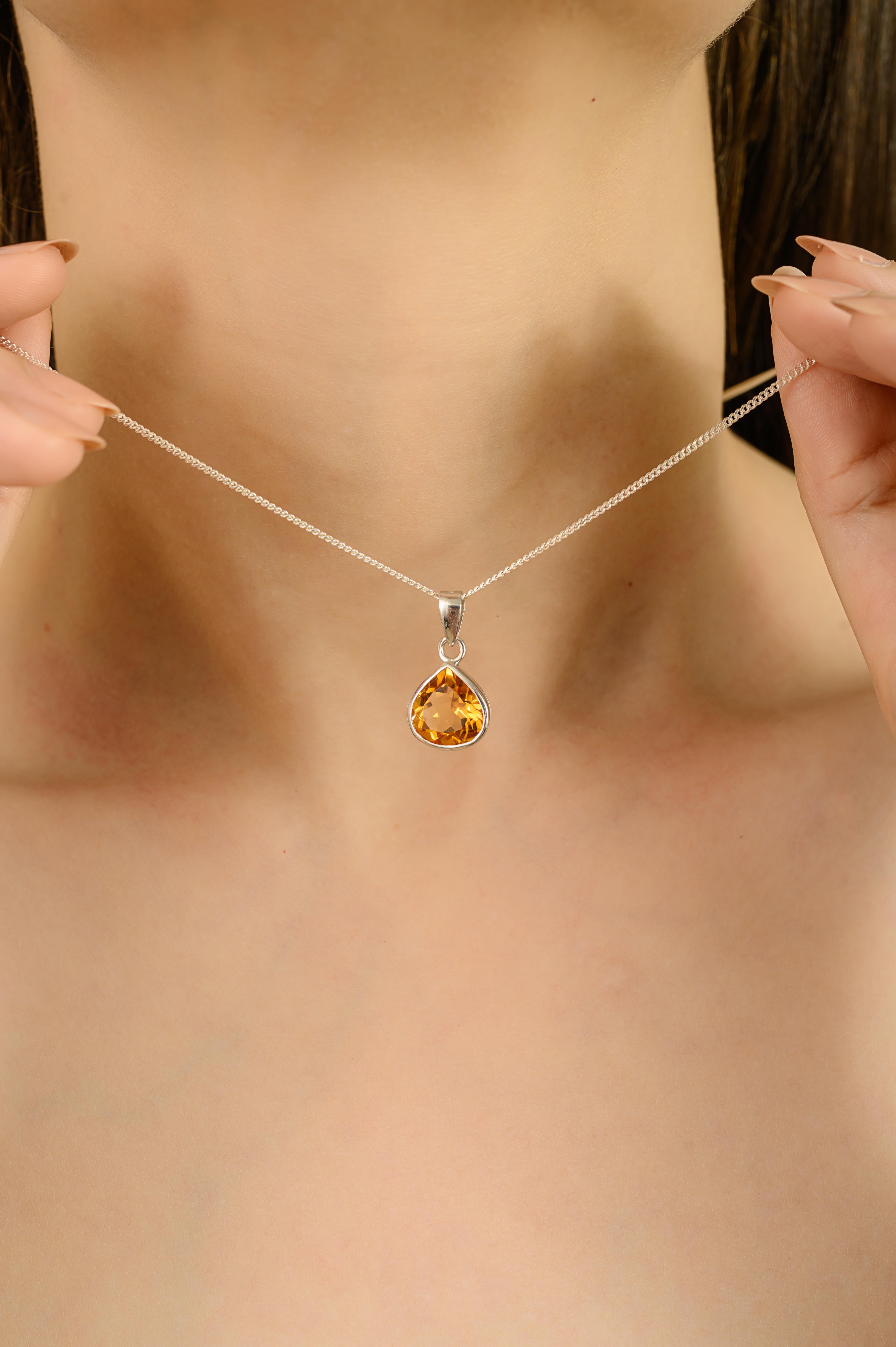 This pendant is made in solid 925 sterling silver and has one natural citrine stone. The stone is pear-shaped and measures 10X8 mm. It weighs 3.95 carats and is held safely by a bezel setting. The pendant weighs 2.33 grams and has a bright yellow