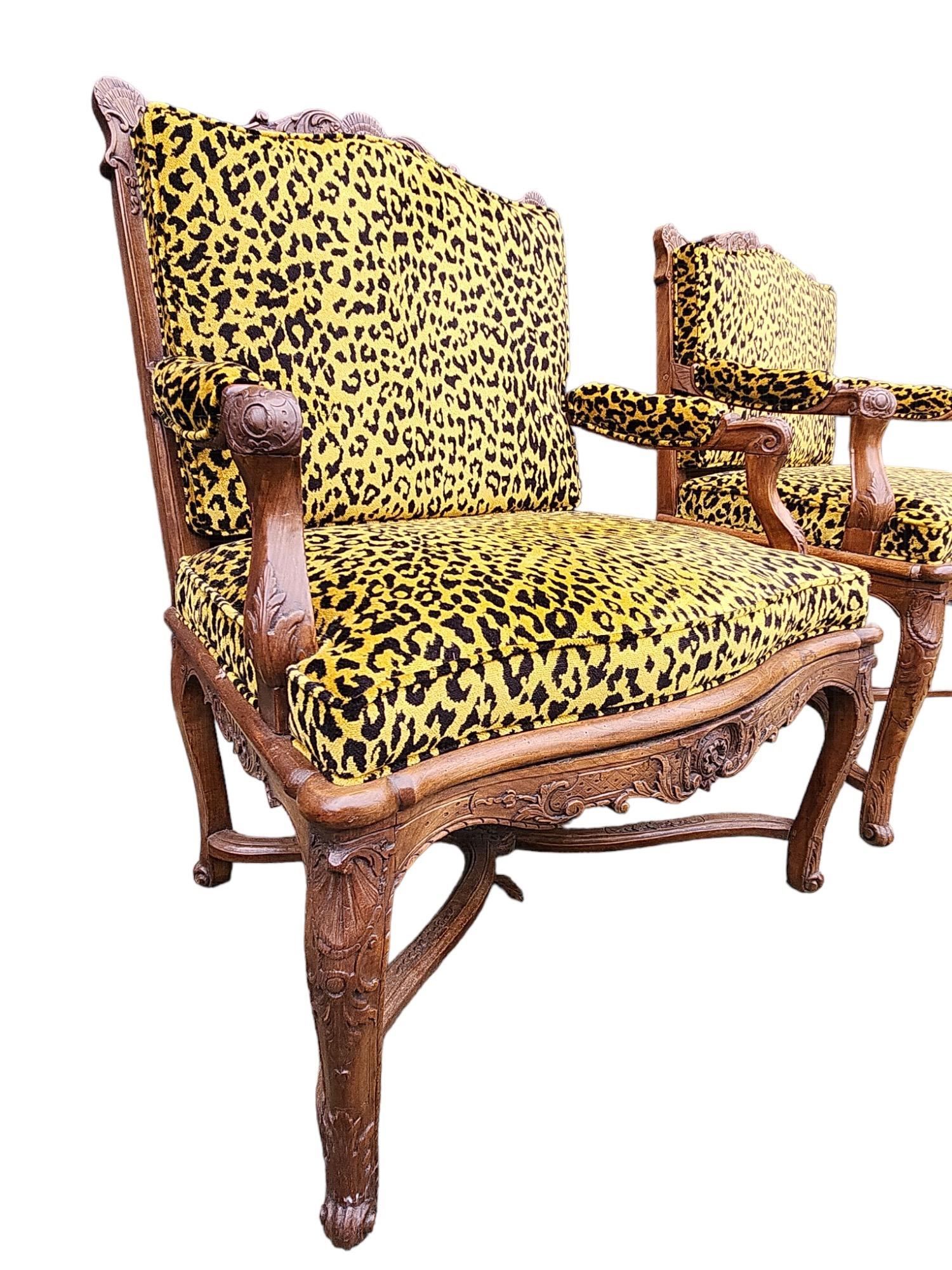 Newly upholstered in Cheetah fabric. The second chair has slightly different dimensions: 27