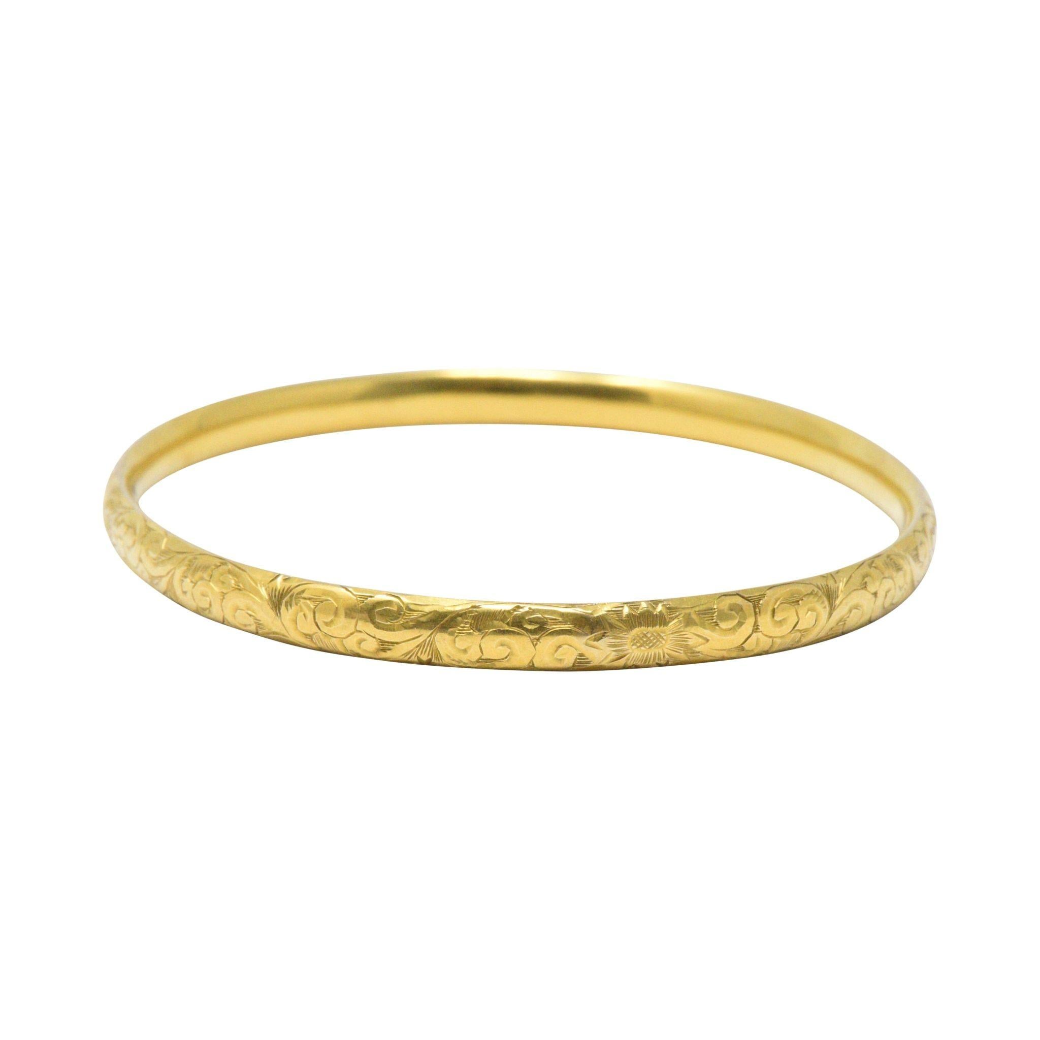 Narrow bangle with fantastic intricately hand engraved foliate motif
Maker's mark for Simmons
Classic Art Nouveau delicate gold work
Inner Circumference: 7 1/2 inches, Width: 4.6 mm
Total Weight: 6.1 Grams
Delicate. Floral. Sweet. 
Circa 1900
 

