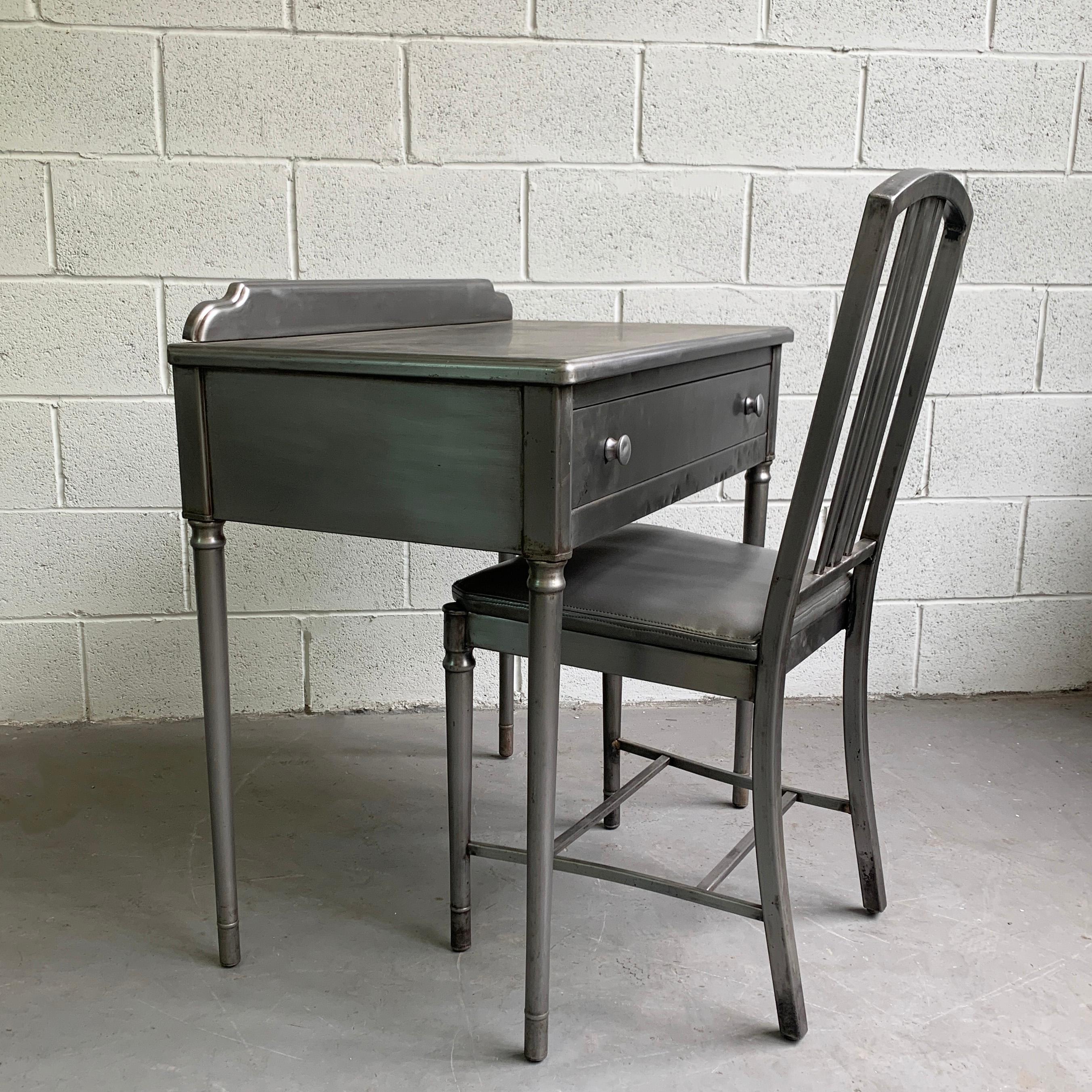 Early 20th century, Sheraton Series vanity or desk set by Simmons Company Furniture features an upholstered gray vinyl chair seat with gray drawer interior. Leg room height is 22.5 inches and the lip on the back of the desk is 2.5 inches height. The