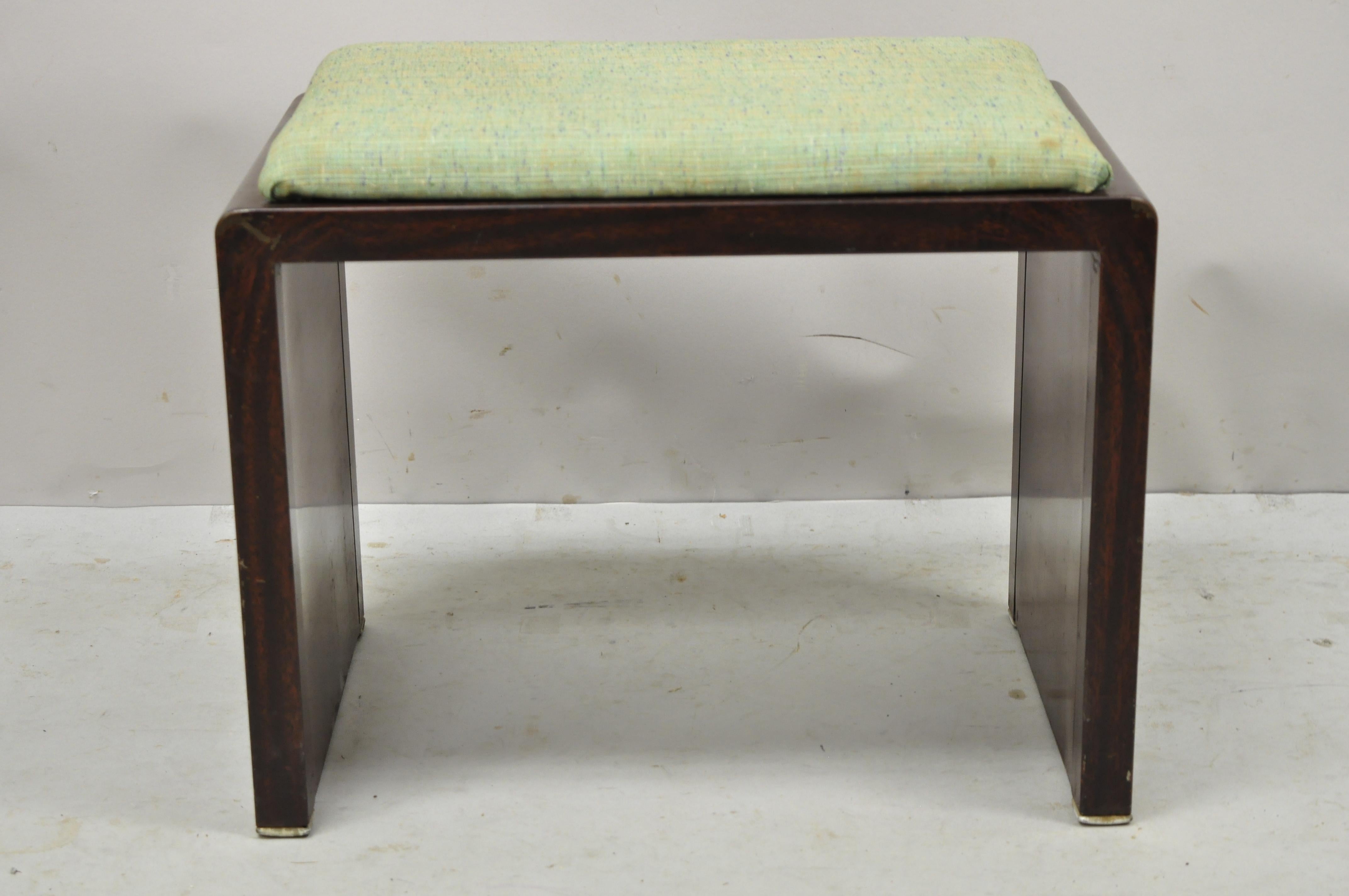 Simmons Norman Bel Geddes steel metal Art Deco brown waterfall vanity bench. Item features steel metal construction, brown wood grain finish, original label, clean modernist lines, quality American craftsmanship, great style and form. Circa 1930s.