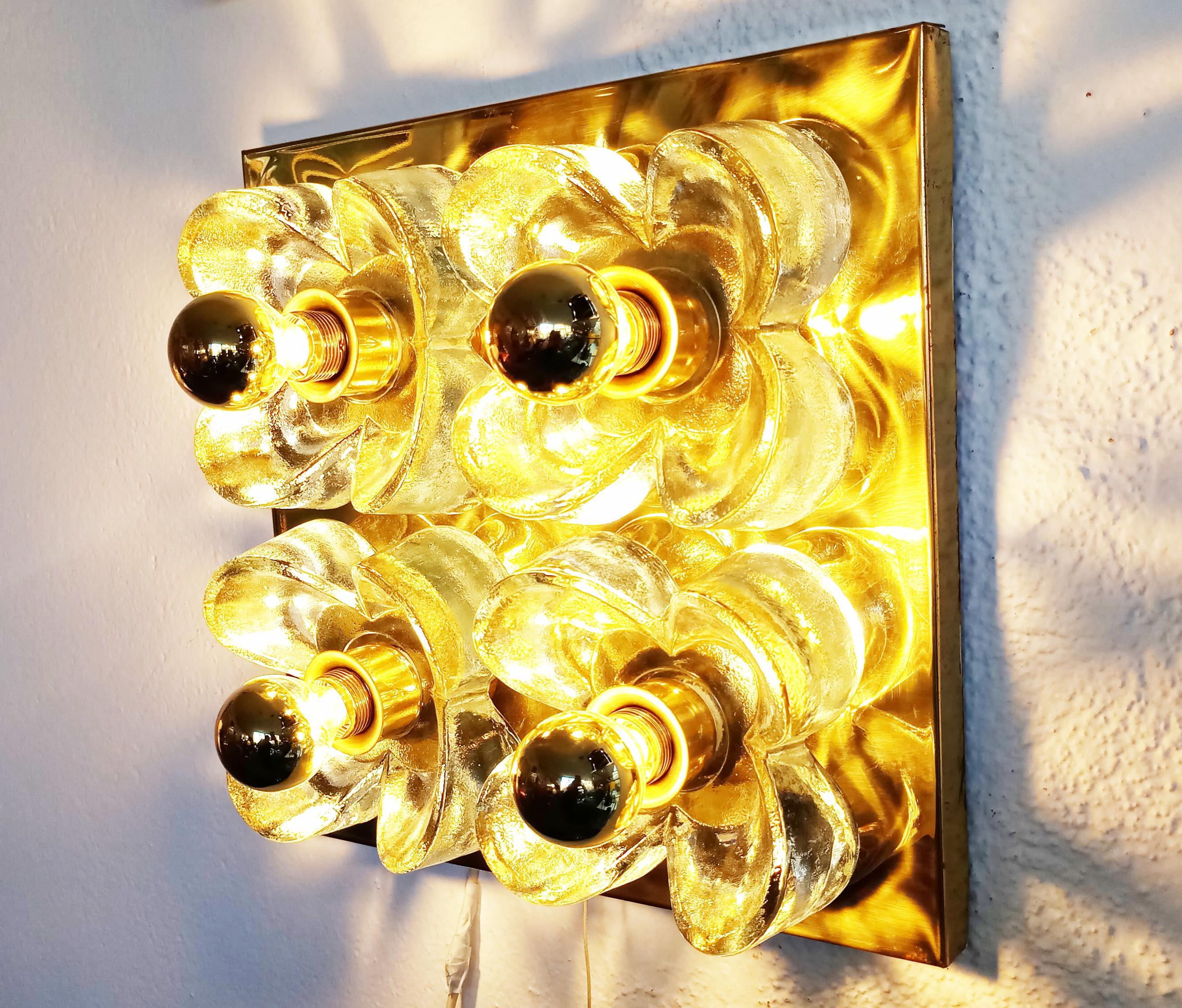 Beautiful and rare flower wall light sconce or table lamp designed by Simon and Schelle for Sische in 1960s, manufactured in Germany. Brass base and Murano glass for the flowers. The 4 specific bulbs golden half moon chrome are included that gives a